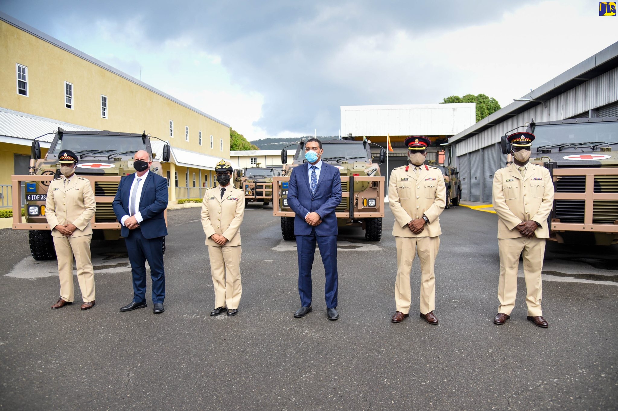Prime Minister, the Most Hon. Andrew Holness  (third right), stands in front of six newly acquired Thales Bushmaster Protected Mobility Vehicles (BPMV), which will be incorporated into Jamaica Defence Force (JDF) security operations. Mr. Holness is joined by (from left) Commanding Officer, Combat Support Battalion, JDF, Lt. Col. Alicia Henry; Programme Manager, International Support Vehicles and Tactical Systems/Protected Vehicles, Thales Australia, Ron Van Der Doorn; Brigade Commander, Jamaica Regiment, JDF, Col. Murphy Pryce; and Officer Commanding, Protected Mobility Vehicle Squadron, JDF, Major Alton Robinson. Occasion was a commissioning ceremony for the vehicles at the JDF’s headquarters, Up Park Camp, Kingston, on Monday (February 21).