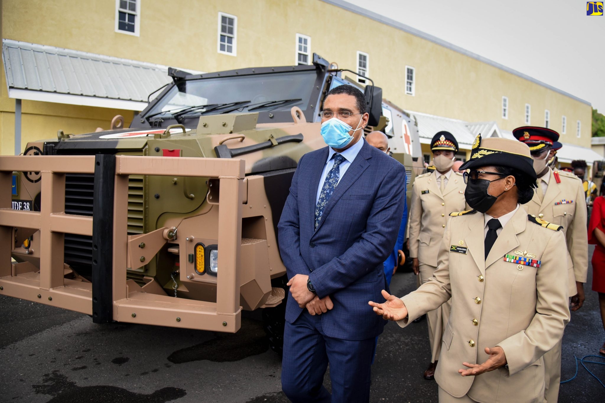 Prime Minister and Minister of Defence, the Most Hon. Andrew Holness (left), is briefed by Chief of Defence Staff, Rear Admiral Antonette Wemyss-Gorman (right), on key features of the six new Thales Bushmaster Protected Mobility Vehicles (BPMV) acquired for the Jamaica Defence Force (JDF). Occasion was a commissioning ceremony for the vehicles at the JDF’s headquarters, Up Park Camp, Kingston, on Monday (February 21).
