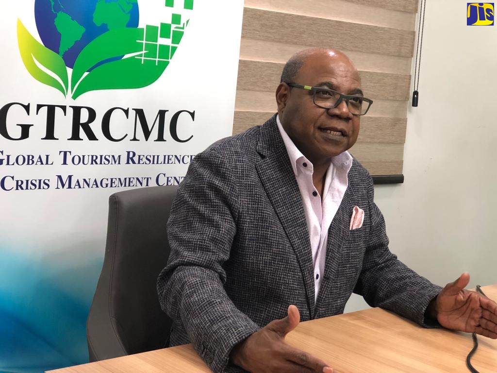 Minister of Tourism, Hon. Edmund Bartlett, addresses a recent function at the Global Tourism Resilience and Crisis Management Centre (GTRCMC) located at the University of the West Indies (UWI), Mona.