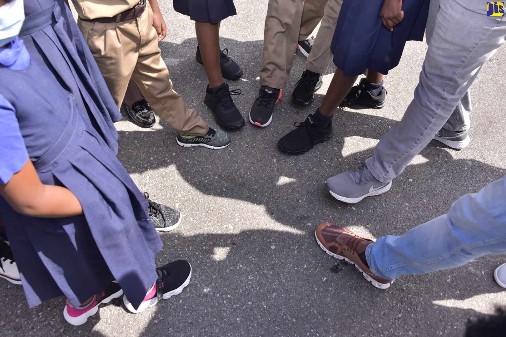 Students from the August Town Primary School in Kingston show sneakers they received from the non-profit organisation, Sole 2 Sole, on Friday, (February 4). 