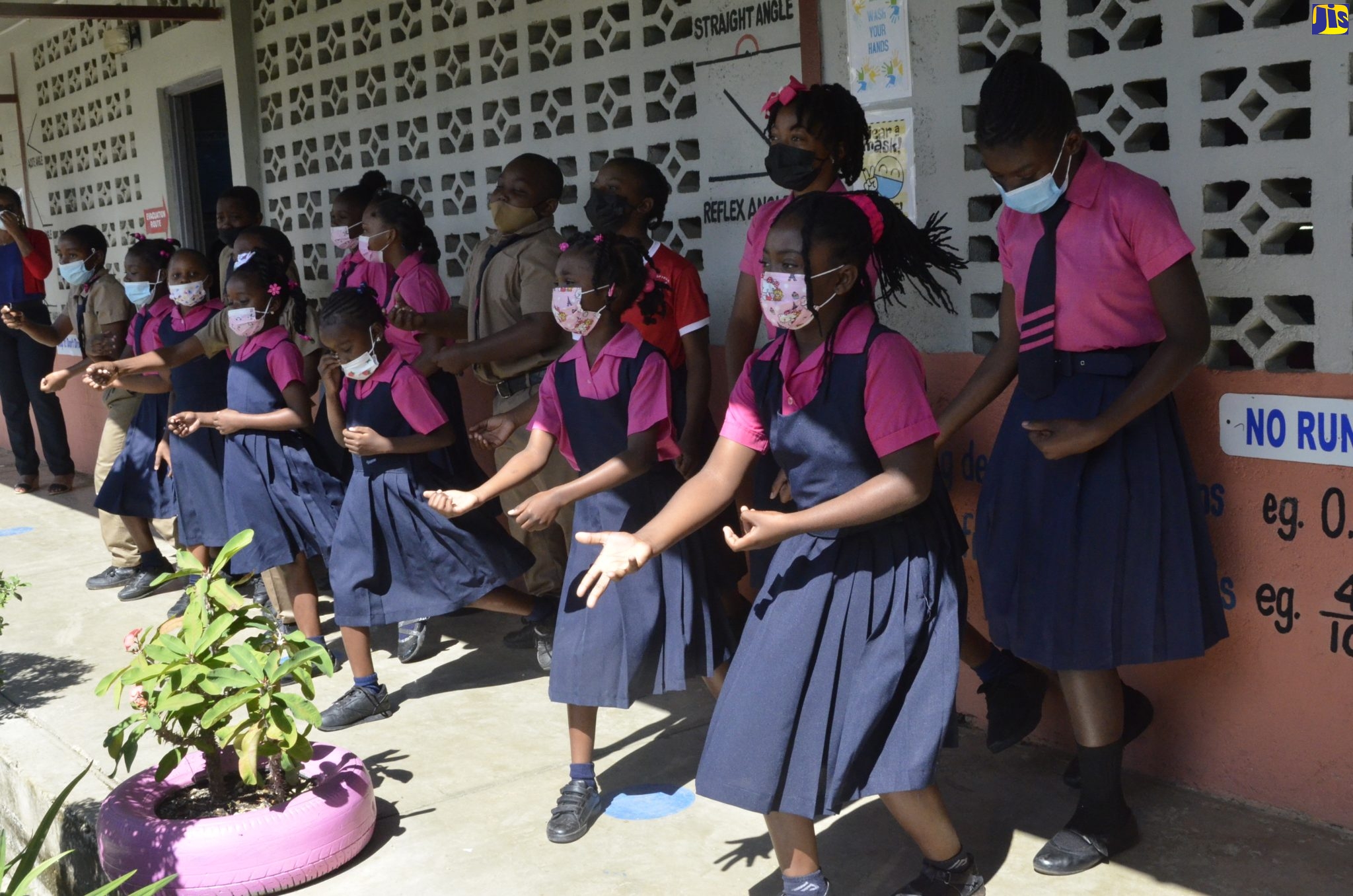 Students of the Springfield Primary and Infant School in St. Elizabeth, perform a rendition of ‘Hold Him Joe’, during a recent visit by the Minister of Local Government and Rural Development, Hon. Desmond McKenzie. 