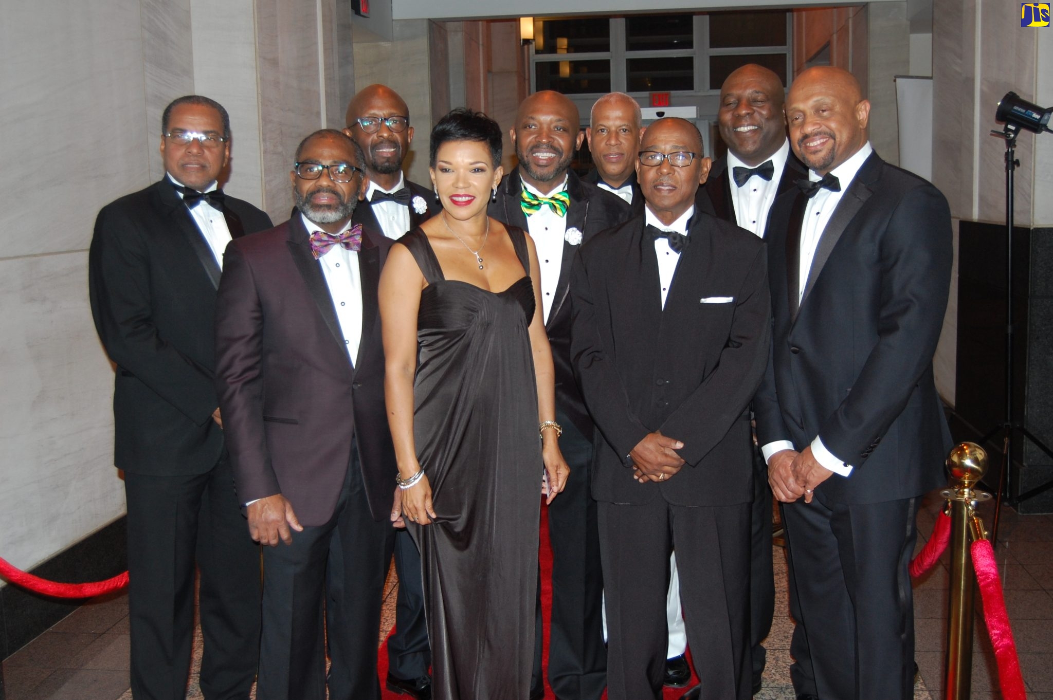 Jamaica’s Ambassador to the United States, Her Excellency Audrey P. Marks, is flanked by members of the David “Wagga” Hunt Memorial Scholarship Committee at its Scholarship Award Red Carpet Ball held in 2020.  