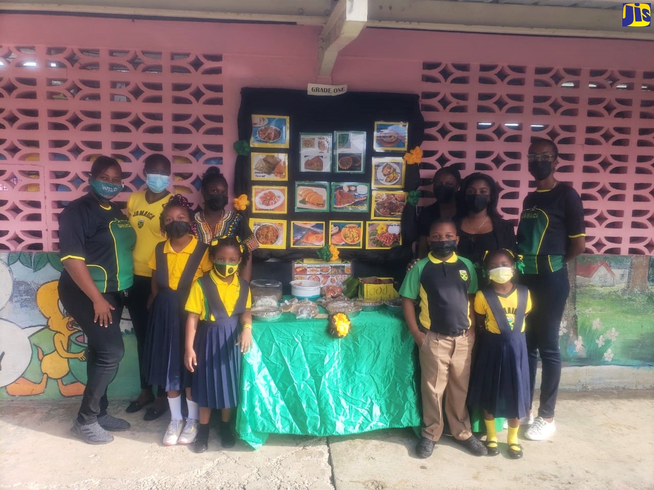 Students and teachers of grade one at Corinaldi Avenue Primary School in St. James show off their display during Jamaica Day, which was celebrated on Friday (February 25).