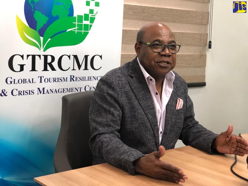 Minister of Tourism, Hon. Edmund Bartlett, addresses journalists during a luncheon at the Global Tourism Resilience and Crisis Management Centre on Tuesday (February 8).