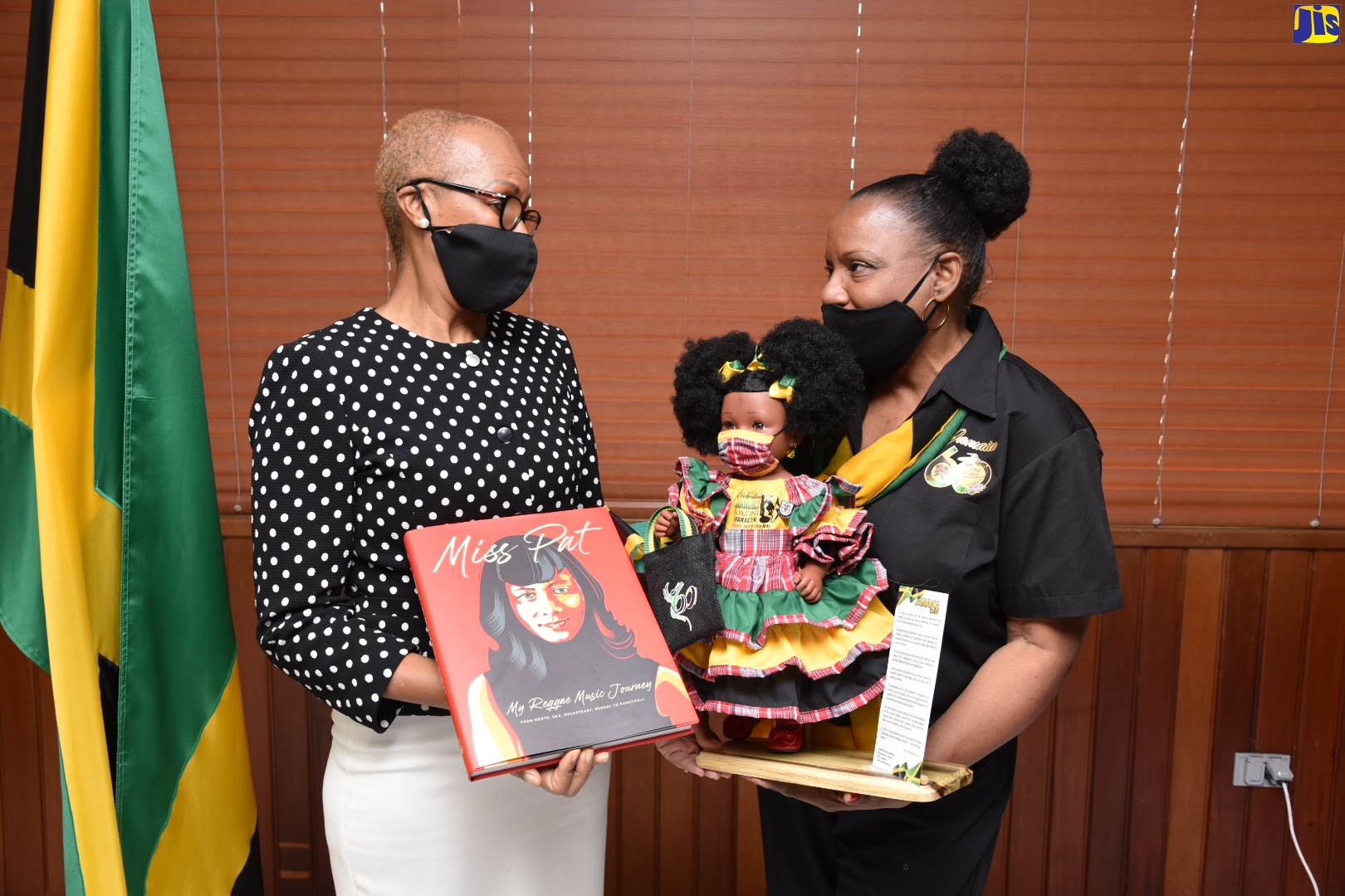 PHOTOS: Education Minister Presented With Book And Jamaican Doll