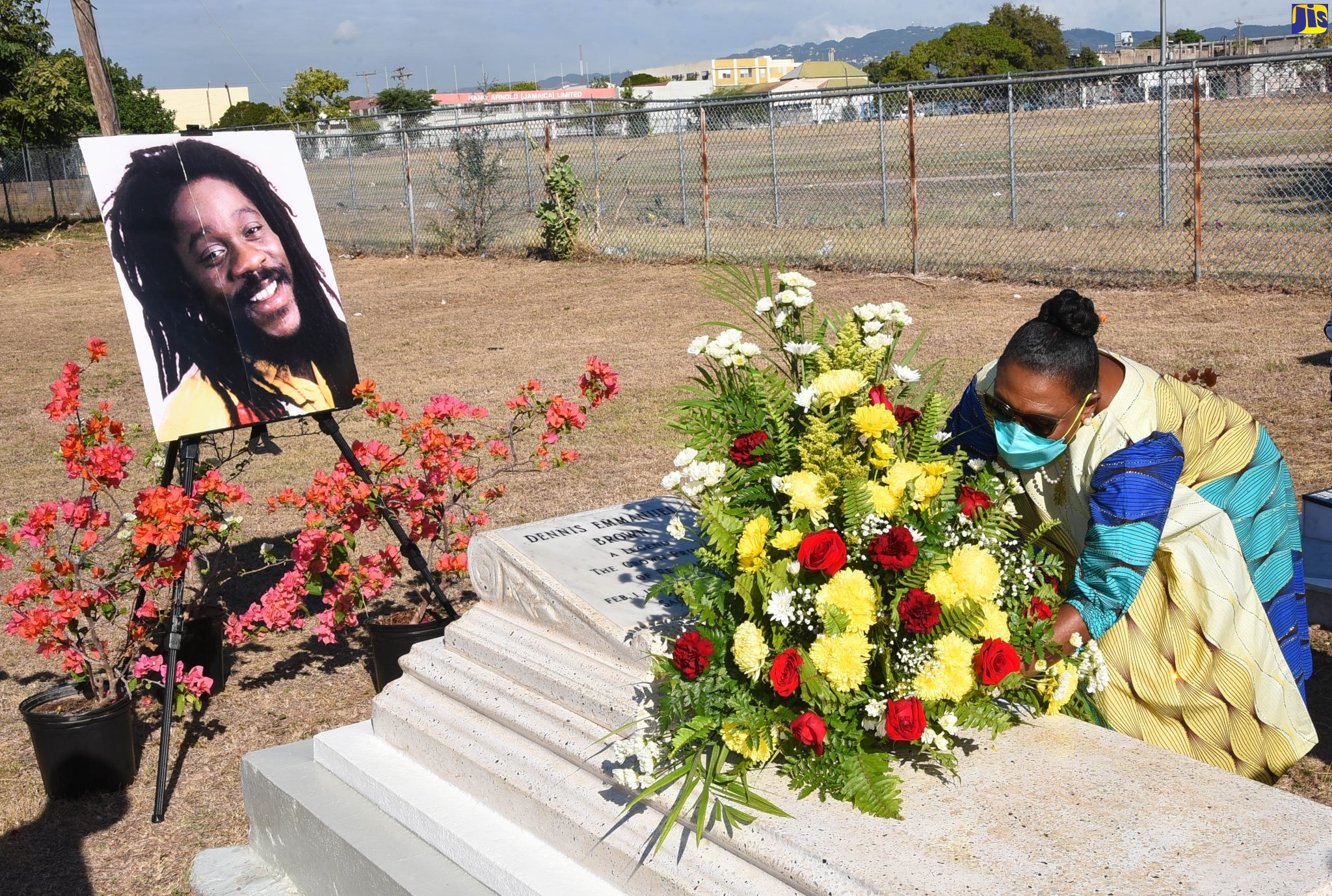 Culture, Gender, Entertainment and Sport Minister, Hon. Olivia Grange, lays flowers on the grave of late reggae music icon, Dennis Brown, during a ceremony to commemorate the 65th anniversary of his birth held on February 1 at National Heroes Park in Kingston. Dubbed the ‘Crown Prince of Reggae’, he recorded more than 75 albums throughout his prolific career and is considered one of the most renowned artistes of the reggae music genre, lovers rock. Dennis Brown was born on February 1, 1957 and died on July1, 1999.