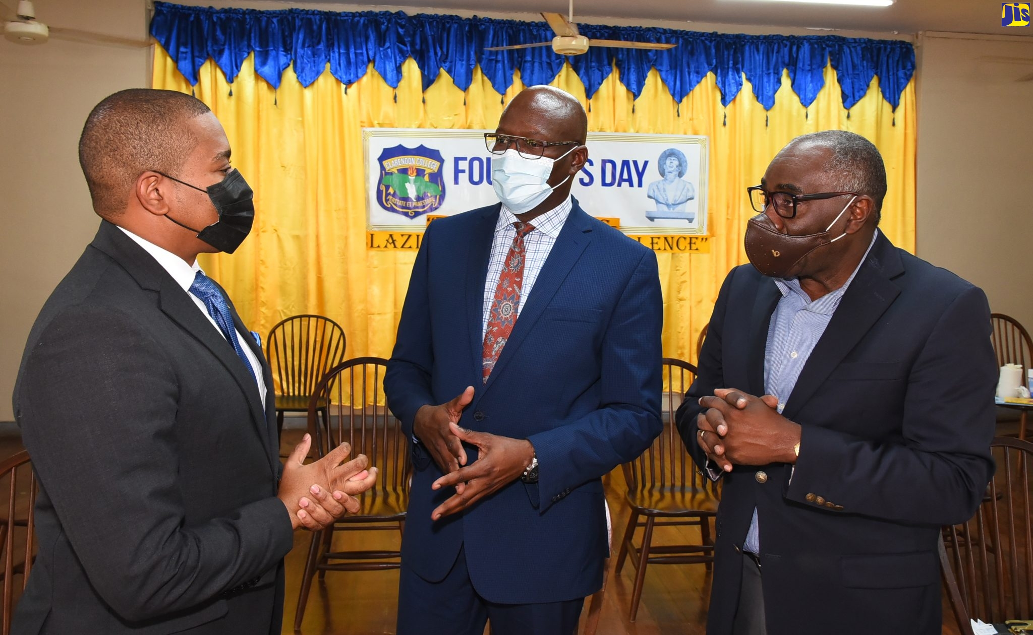 From left, Minister Without Portfolio in the Office of the Prime Minister, Hon. Floyd Green, in discussion with Principal of Clarendon College, David Wilson, and sponsor of the John McMillan Lecture Series, Norman Reid, following Thursday's lecture held at the school in Clarendon. 