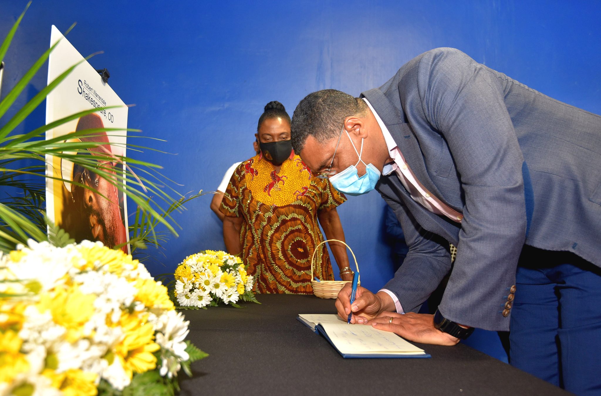 Prime Minister, the Most Hon. Andrew Holness, signs a Condolence Book that was opened for late Reggae icon and bass guitarist extraordinaire, Robert 