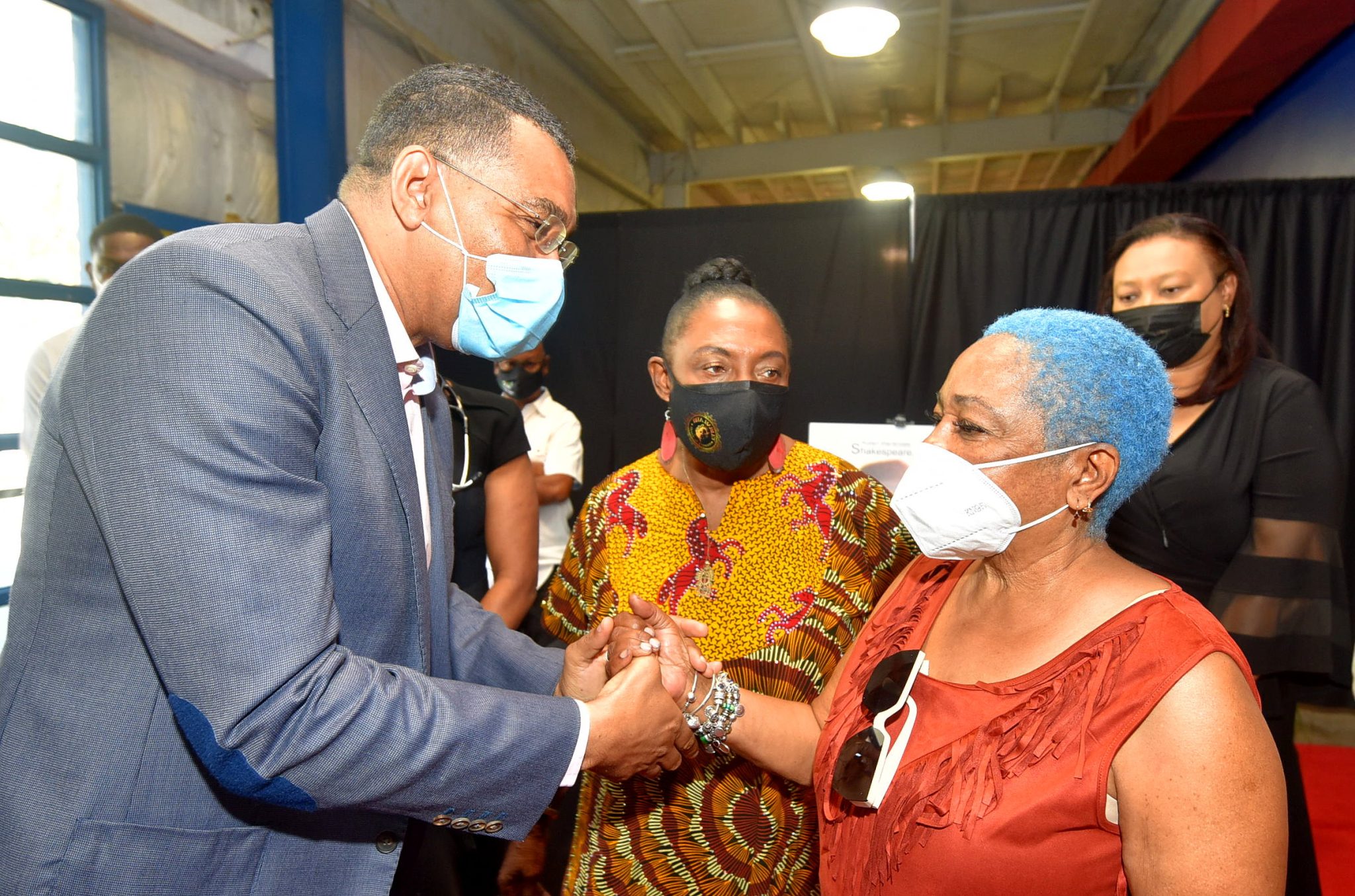 Prime Minister, the Most Hon. Andrew Holness, commiserates with Marian Shakespeare, widow of late master bass player, Robert 