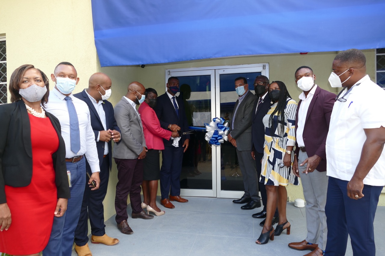 It was a grand occasion as NWC representatives and specially invited guests geared up to cut the ribbon to officially open the renovated St James Customer Care Office. From left: Marcelyn Murray, Customer Relations Manager; Kevin Kerr, Vice President of Divisional Operations; Dwight Crawford, Councillor for the Spring Garden Division; Herman Fagan, Regional Manager for St. James and Trelawny; Andrea Gyles, Vice President of Corporate Services; Mark Barnett, NWC President; Homer Davis, Minister of State in the Ministry of Local Government and Rural Development and Member of Parliament for St. James Southern; Reverend Conrad Pitkin, Custos of St. James; Janet Silvera, President of the Montego Bay Chamber of Commerce; Richard Vernon, Deputy Mayor of Montego Bay; and Heroy Clarke, Member of Parliament of St James Central. 