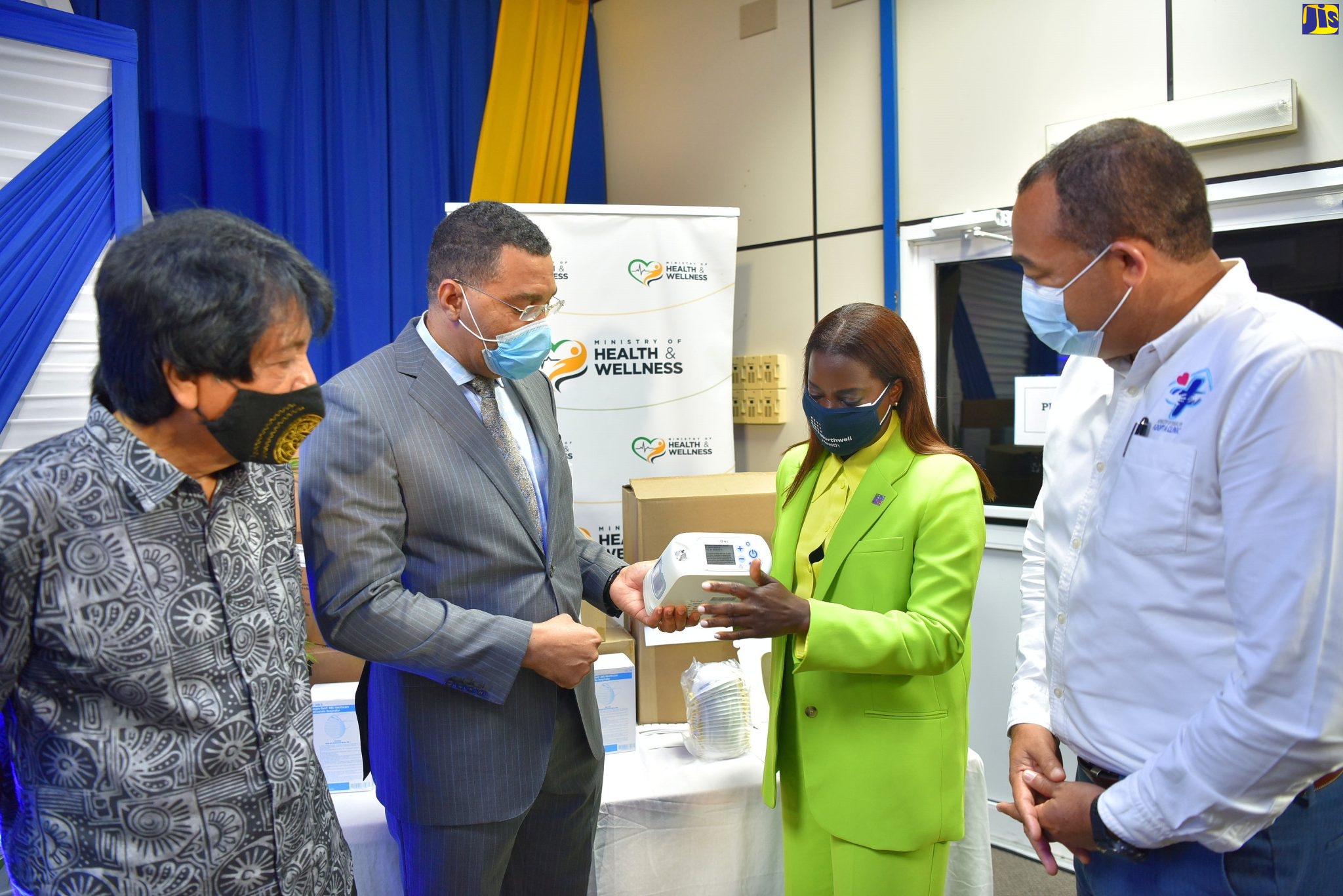 Prime Minister, the Most Hon. Andrew Holness (second left) discusses the benefits of the oxygen concentrator with Director, Patient Care Services, Northwell Health, Dr. Sandra Lindsay (second right). Looking on (from left) are: Chairman of the Bustamante Hospital for Children’s Management Committee, Kenneth Benjamin; and Minister of Health and Wellness, Dr. the Hon. Christopher Tufton. Occasion was the handover of medical equipment and supplies, valued at over US$800,000, to the Government of Jamaica by the United States-based Northwell Health, at the Bustamante Hospital for Children in Kingston on Friday (Feb. 11).