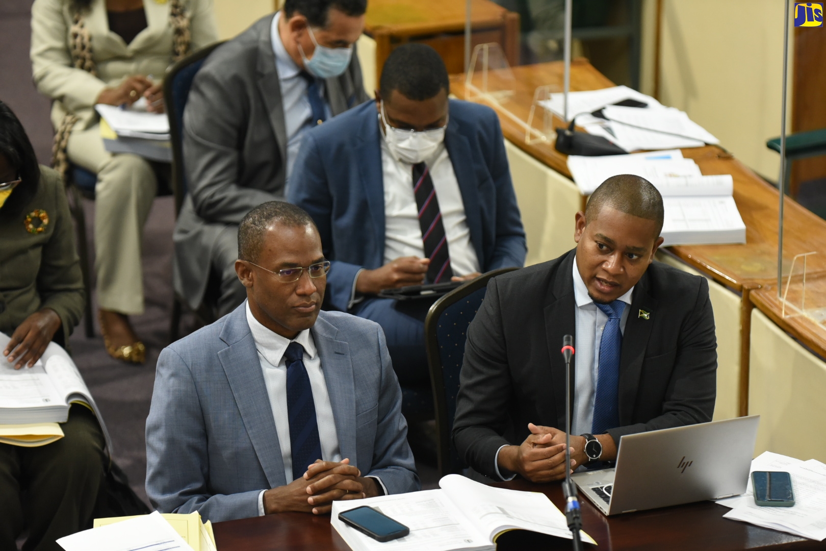 Minister without Portfolio in the Office of the Prime Minister, Hon. Floyd Green (right), addressing Tuesday’s (March 1) meeting of the Standing Finance Committee of the House of Representatives at Gordon House. At left is Minister of Finance and the Public Service, Dr. the Hon. Nigel Clarke.
