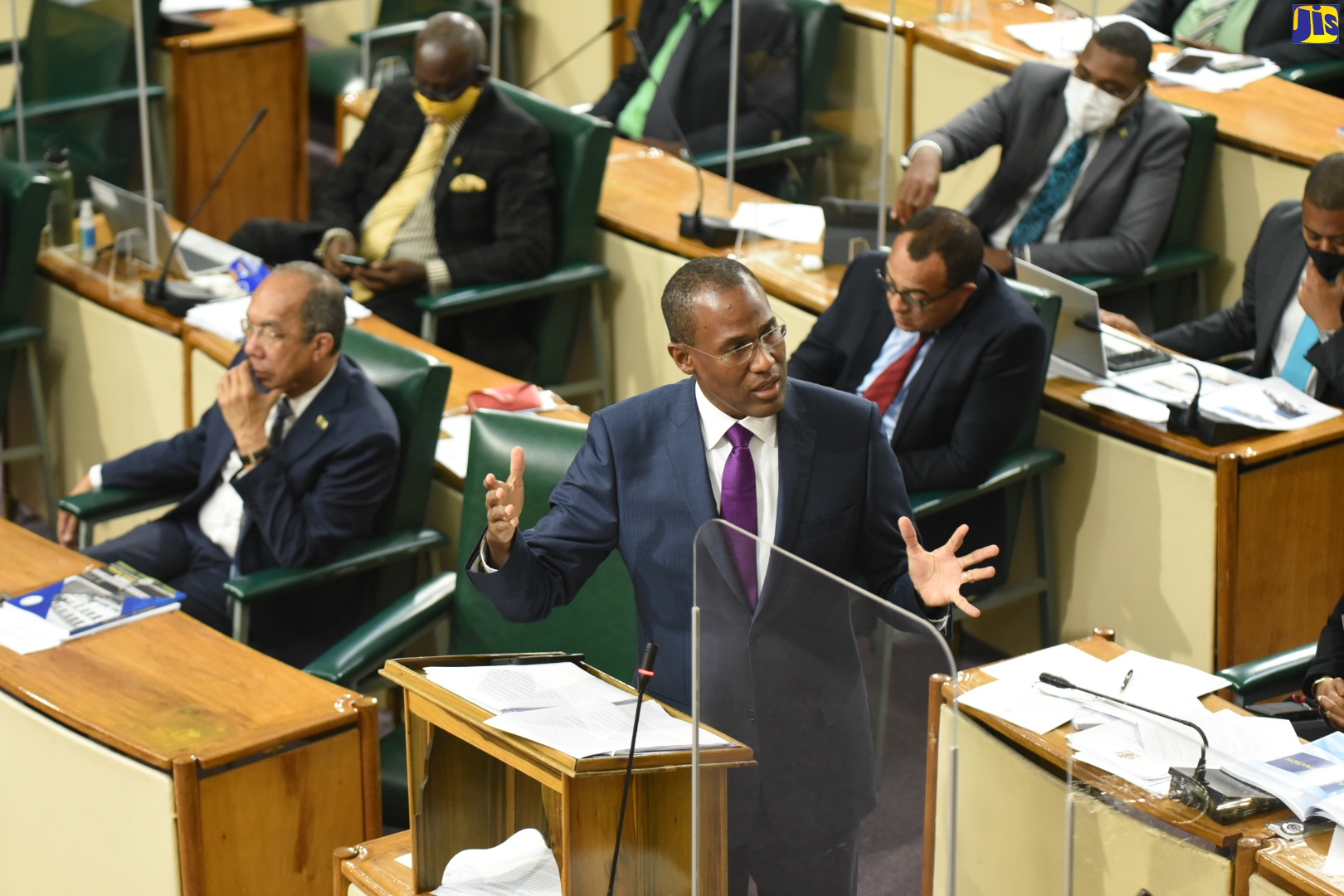 Minister of Finance and the Public Service, Dr. the Hon. Nigel Clarke, opens the 2022/23 Budget Debate in the House of Representatives on Tuesday (March 8). To his right is Deputy Prime Minister and Minister of National Security, Hon. Dr. Horace Chang.
