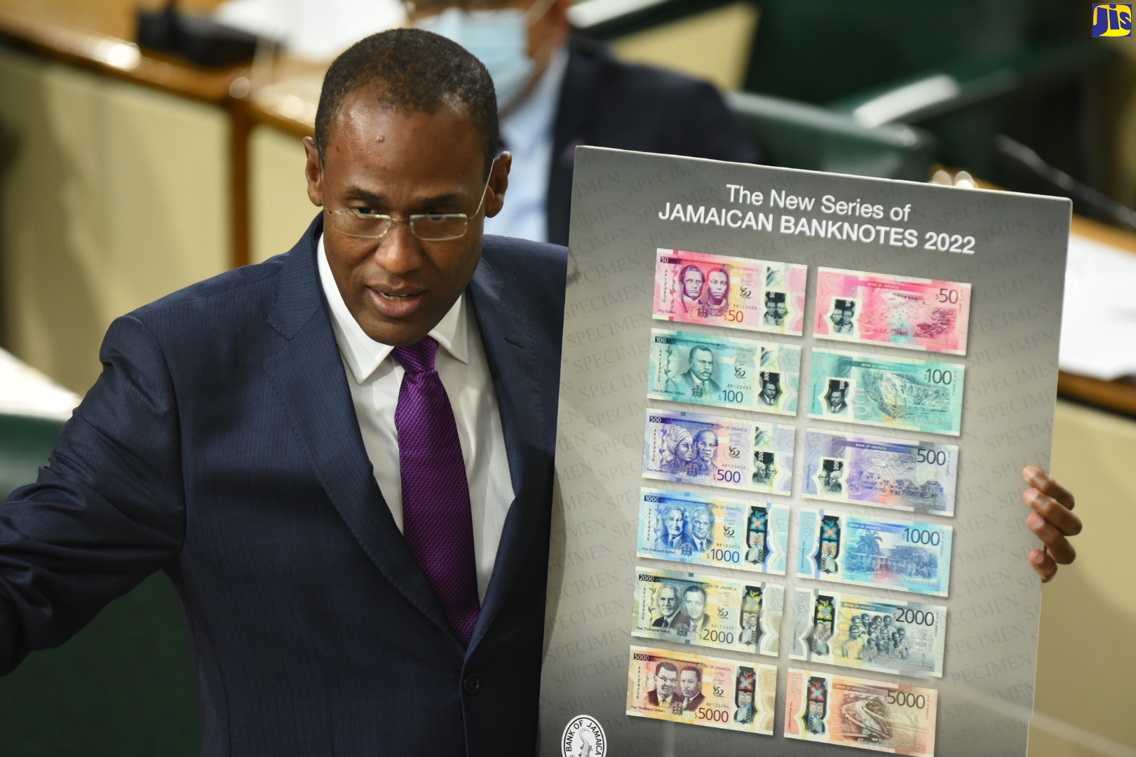 Minister of Finance and the Public Service, Dr. the Hon. Nigel Clarke, displays the new/upgraded banknotes, which will go into circulation later this year.  Dr. Clarke was opening the 2022/23 Budget Debate in the House of Representatives on Tuesday (March 8).
