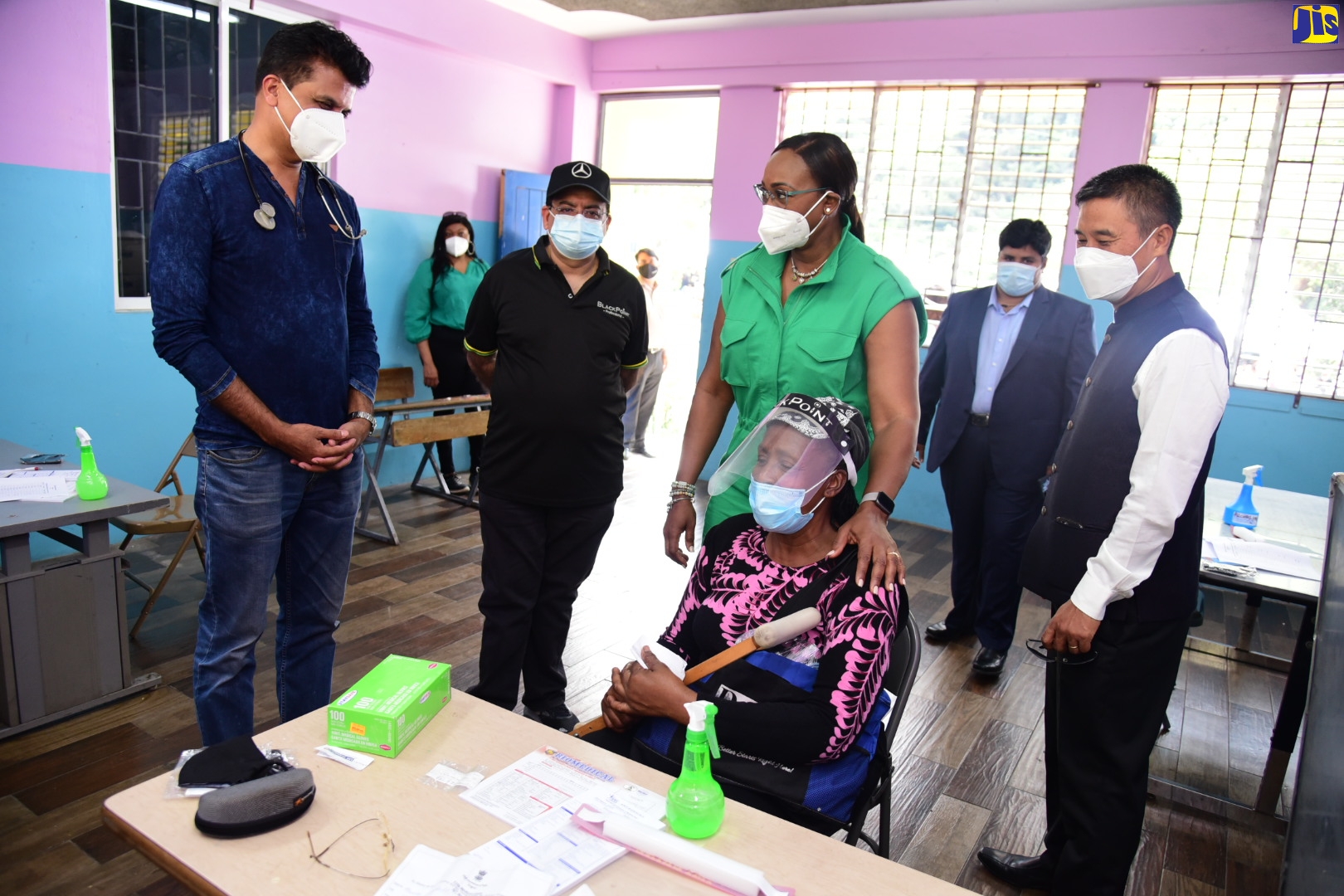 Member of Parliament of St. Andrew East Rural, the Most Hon. Juliet Holness (third left), places a comforting hand on the shoulder of resident of Kintyre District, Maxine Campbell, while speaking to General Physician, Dr. Ram Shetty (left). The occasion was a medical camp staged by the Indian High Commission on March 27 at the St. Martin de Porres Primary School in the constituency. Looking on are Managing Director, appliance manufacturing company, BlackPoint, Gul Mansukhani (second left); and High Commissioner of India to Jamaica, His Excellency Rungsung Masakui.
