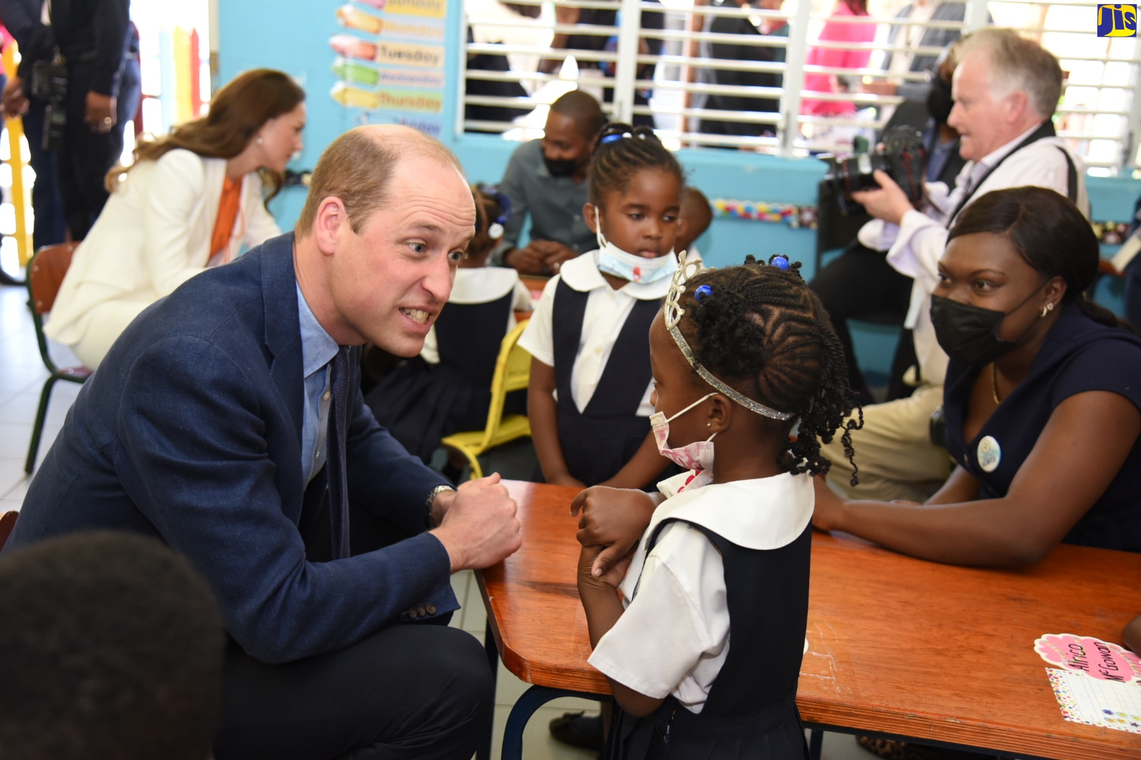 Her Royal Highness, the Duchess of Cambridge (left), speaks with young students of the Shortwood Practising Primary and Infant School. Their Royal Highnesses, the Duke and Duchess of Cambridge, visited the Shortwood Teachers’ College in St. Andrew on Wednesday (March 23).  The Duke and Duchess met briefly with researchers and members of the early-childhood faculty to discuss the administration of early-childhood education in Jamaica. The Royal couple is on a three-day (March 22 to 24) official visit to the island as part of activities to celebrate the Platinum Jubilee of The Duke