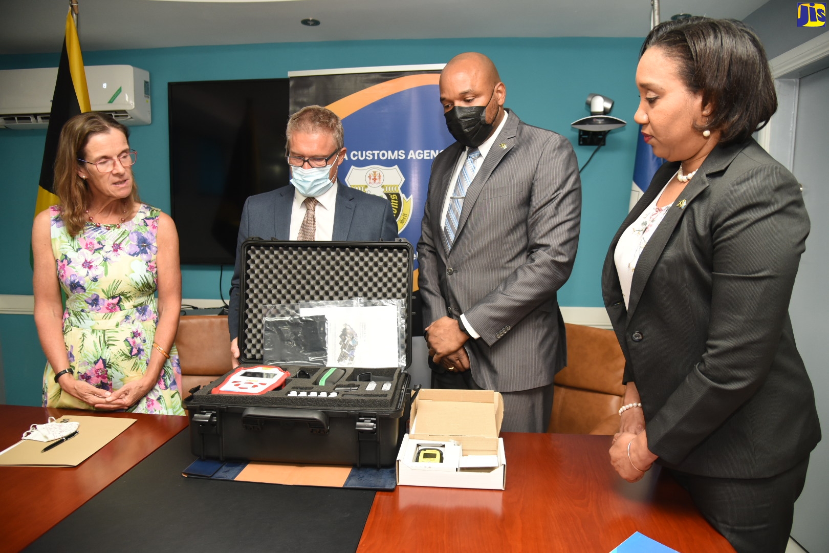 Jamaica Customs Agency (JCA) Chief Executive Officer (CEO) and Commissioner of Customs, Velma Ricketts Walker (right), and Deputy CEO, Border Protection, Alwyn Nicely (second right), examine kits and equipment donated to the JCA by the British Government through United Kingdom (UK) Border Force International. The provisions were handed over during a Memorandum of Understanding (MOU) signing ceremony at the JCA on Tuesday (March 29) for a $22 million grant from the British Government that will aid in significantly bolstering the JCA’s border protection capability. Looking on (from left) are British High Commissioner to Jamaica, Her Excellency Judith Slater, and UK Border Force International Western Caribbean Regional Manager, Mike Gorrie.
