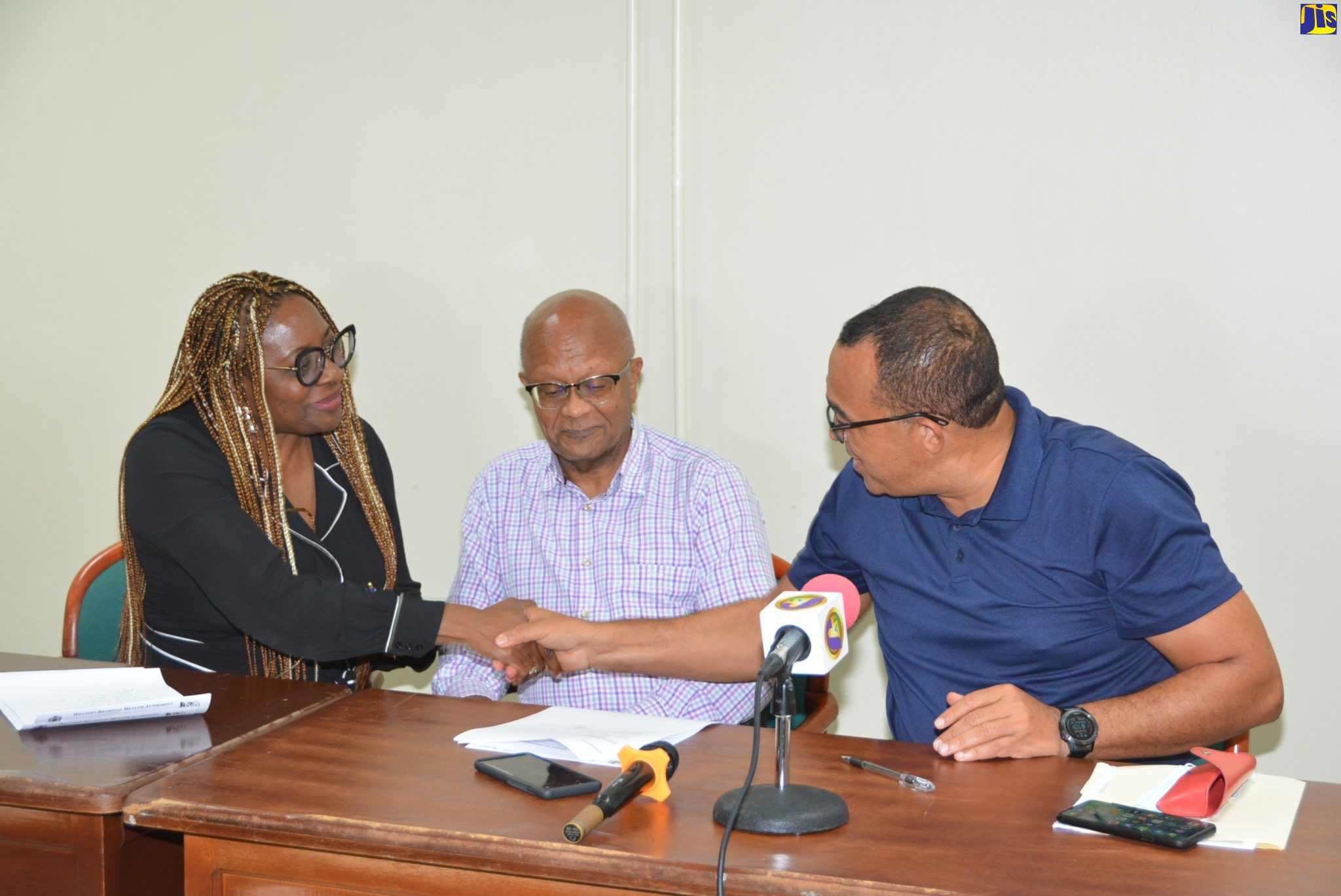 Minister of Health and Wellness Dr. the Hon. Christopher Tufton (right), welcoming the new Chairman of the Cornwall Regional Hospital (CRH) oversight committee Dr. Jeffery East (centre),  and President of the Montego Bay Chamber of Commerce and Industry Janet Silvera, during a meeting at the Cornwall Regional Hospital