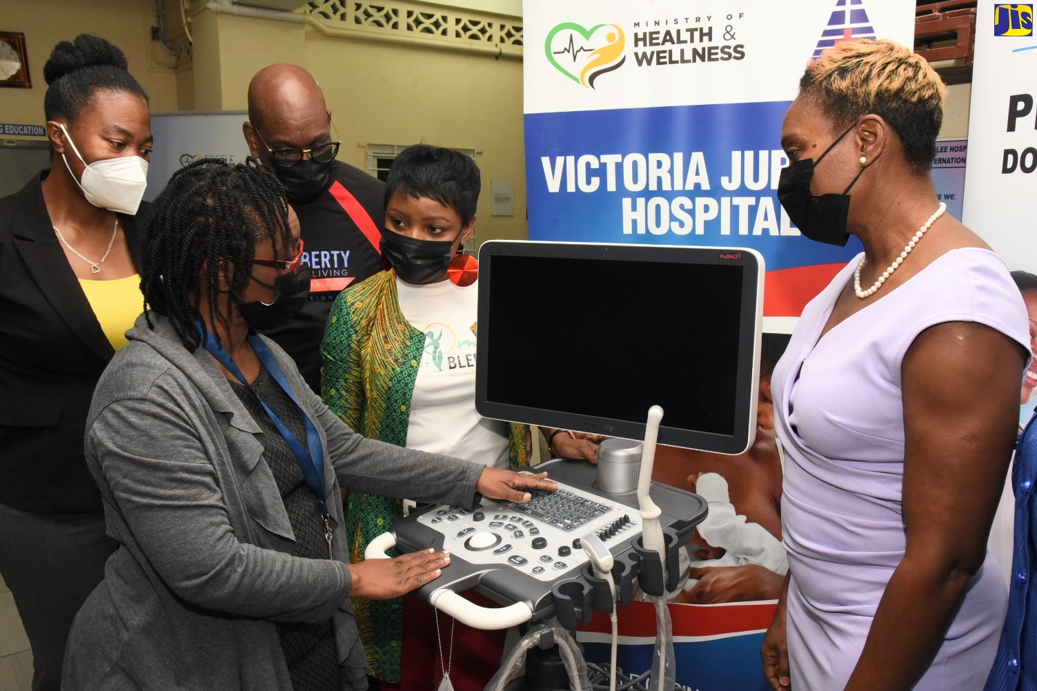 Minister of State in the Ministry of Health and Wellness, Hon. Juliet Cuthbert Flynn (right), observes as Acting Consultant for Sexual and Reproductive Health, Victoria Jubilee Hospital (VJH), Dr. Kaye Palmer-Cole (second left), demonstrates the functions of a DC-30 ultrasound machine, valued at US$18,000, which was donated to the institution recently by the Women Without Blemish Ministry of the Liberty for Living Ministries International. Others observing (from left) are Deputy CEO, VJH, Dr. Diane McIsaacs; Living Ministries International head, Pastor Rowan Wade; and wife and President, Women Without Blemish Ministry, Pastor Marsha Wade. The presentation took place at the hospital.