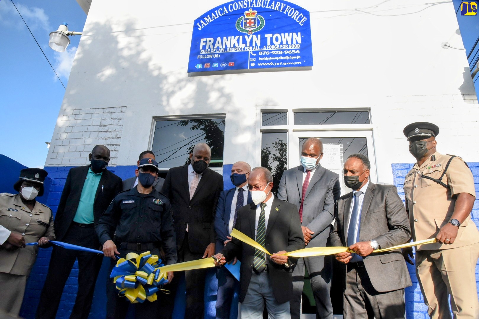Deputy Prime Minister and Minister of National Security, Hon. Dr. Horace Chang (front, centre),  cuts the ribbon to reopen the refurbished Franklyn Town Police Station in Kingston on March 16. He is assisted by Commissioner of Police, Major General, Antony Anderson (front, left), and Managing Director, Jamaica Social Investment Fund (JSIF), Omar Sweeney (front, second right). Looking on (in background from left) are Commanding Officer, Eastern Kingston Police Division, Superintendent Tommie-Lee Chambers; Permanent Secretary in the Ministry of National Security, Courtney Williams; Member of Parliament, Central Kingston, Donovan Williams; Chairman, JSIF, Dr. Wayne Henry; Head of Cooperation, Delegation of the European Union (EU) to Jamaica, Aniceto Rodríguez Ruiz; Minister of State in the Ministry of National Security, Hon. Zavia Mayne; and Assistant Commissioner of Police, in Charge of Area Four, Donovan Graham.