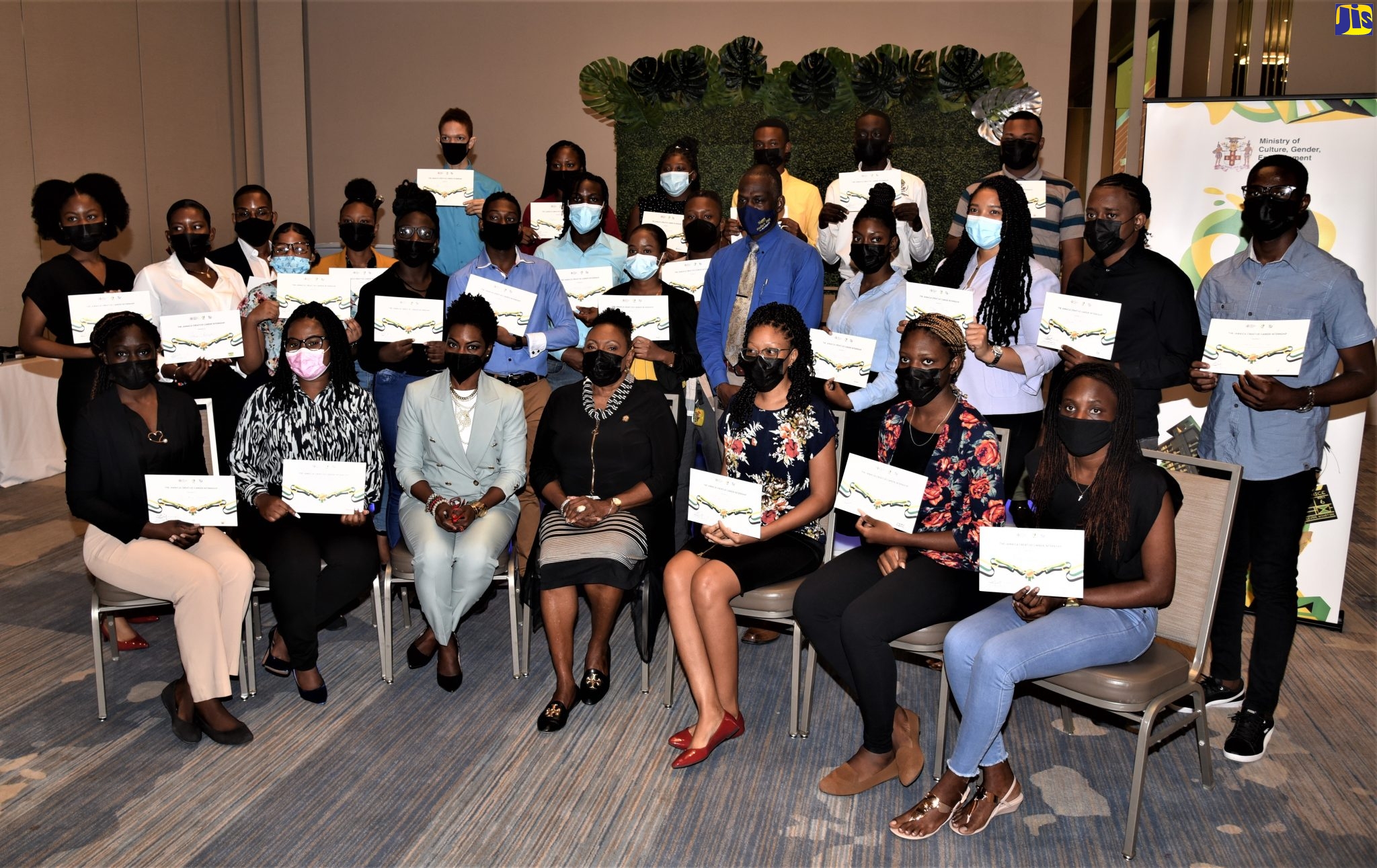 Minister of Culture, Gender, Entertainment and Sport, Hon. Olivia Grange (seated, centre); National Director of the Entertainment, Culture and Creative Industries Council (Jamaica Creative), Marisa Benain (seated, third left); and Permanent Secretary in the Ministry, Denzel Thorpe (standing second row, fifth right), are pictured with the initial 30 participants in the Jamaica Creative Internship Programme, at the awards ceremony held earlier this month at the AC Marriott Hotel in New Kingston.   A total of 60 scholarships are to be awarded under the programme for this year. 