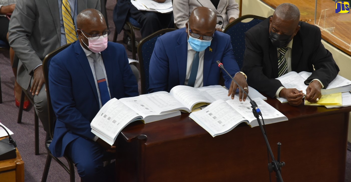 Agriculture and Fisheries Minister, Hon. Pearnel Charles Jr. (centre), responds to questions during Tuesday’s (March 1) meeting of the Standing Finance Committee of the House of Representatives, whose members are deliberating the 2022/23 Estimates of Expenditure. With the Minister are Permanent Secretary in the Ministry, Dermon Luke Spence (left), and Minister of State, Hon. Franklin Witter.