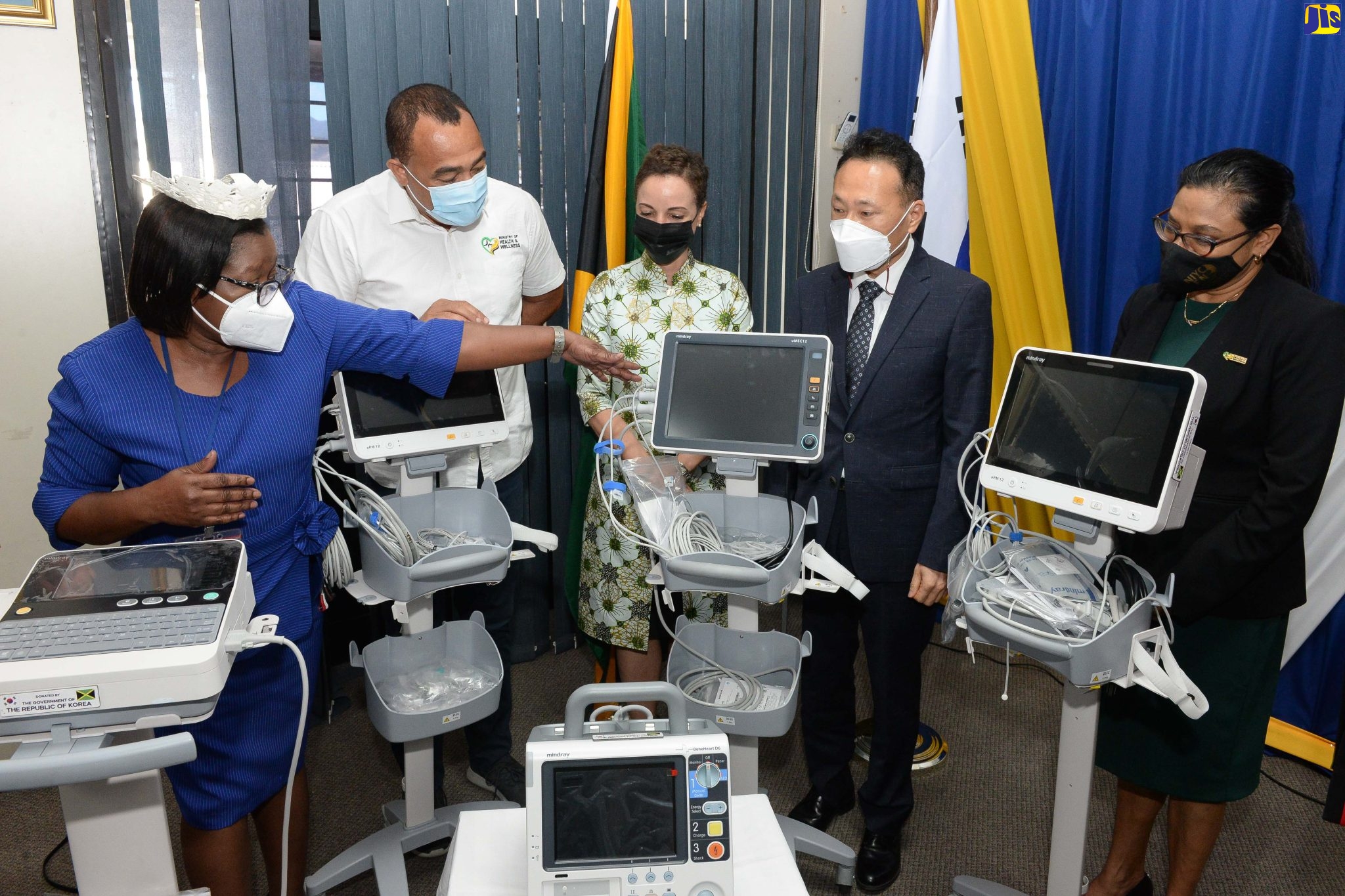 Minister of Health and Wellness, Dr. the Hon. Christopher Tufton (second left), Minister of Foreign Affairs and Foreign Trade, Senator the Hon. Kamina Johnson Smith (centre), and Charge d’Affaires at the Embassy of the Republic of Korea in Jamaica, Baejin Lim (second right), listen as Director of Nursing Services, Bustamante Hospital for Children, Beverley Senior Berry (left), explains the functions of one of several pieces of medical equipment donated by the Korean Government to aid in the national COVID-19 response. The presentation was made at the hospital on Thursday (March 24). Also listening is the hospital’s Senior Medical Officer, Dr. Michelle-Ann Richards Dawson.