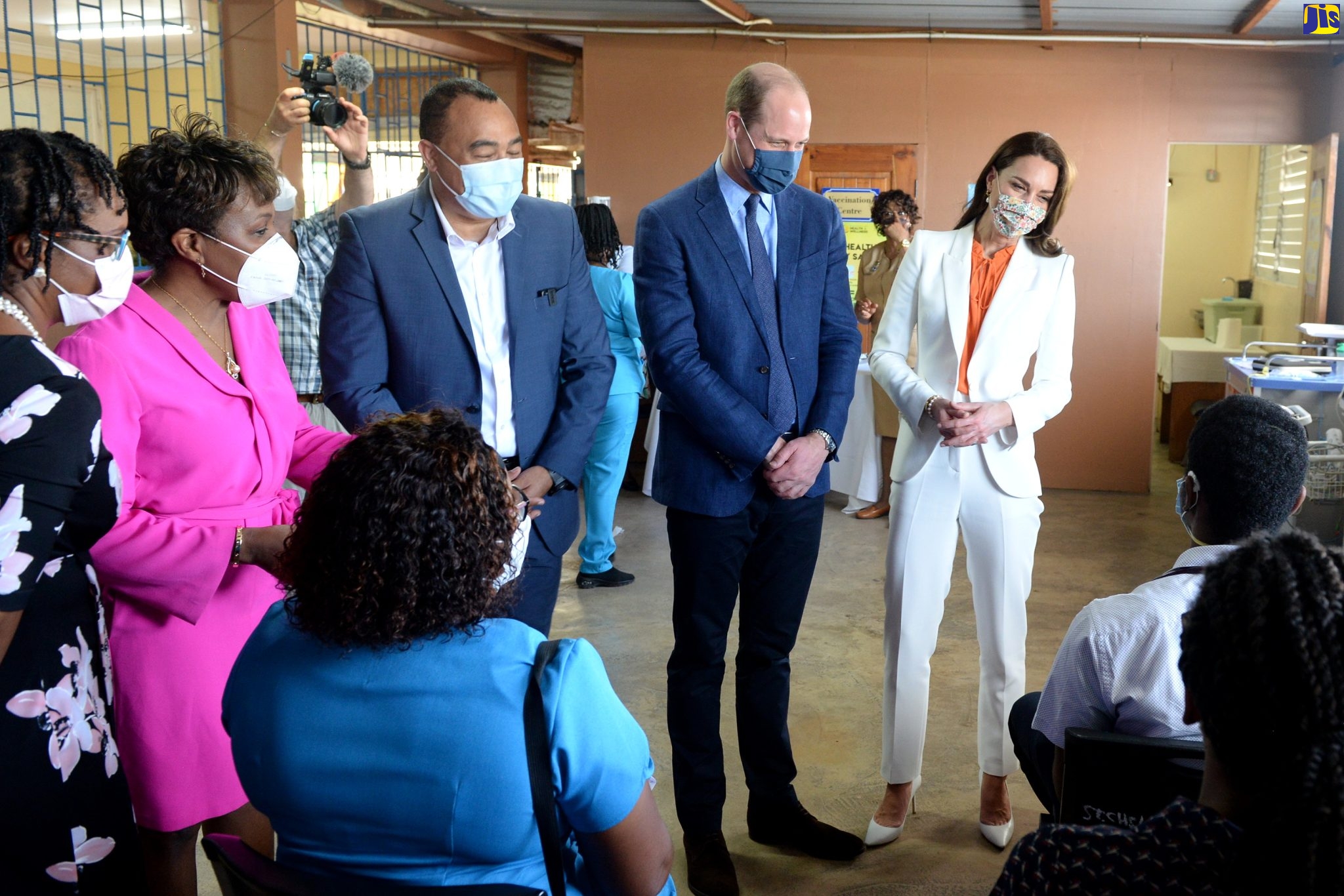 Their Royal Highnesses, the Duke and Duchess of Cambridge (second right and right, respectively), interact with staff members at the Spanish Town Hospital, during a visit to the health facility on Wednesday, March 23.  With them are Minister of Health and Wellness, Dr. the Hon. Hon. Christopher Tufton (centre); CEO of the hospital, Jacqueline Ellis (left) and Senior Medical Officer at the hospital,  Dr. Jacqueline Wright-James.