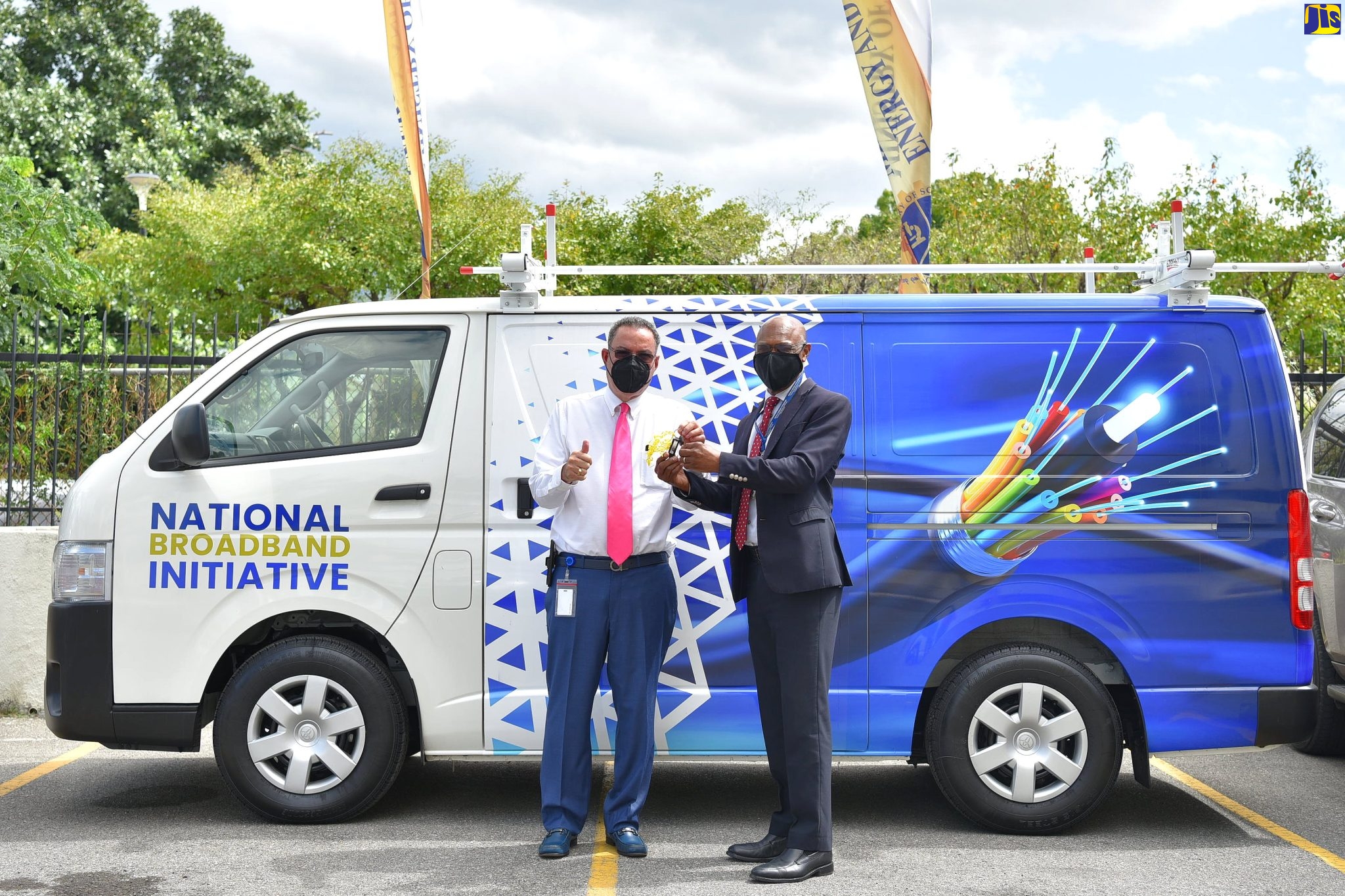 Minister of Science, Energy and Technology, Hon. Daryl Vaz (left) hands over the keys to the 2021 Toyota HiAce bus to Chief Executive Officer at the National Works Agency, Everton G. Hunter during a ceremony held on March 17, at the Ministry’s Trafalgar Road offices in Kingston.