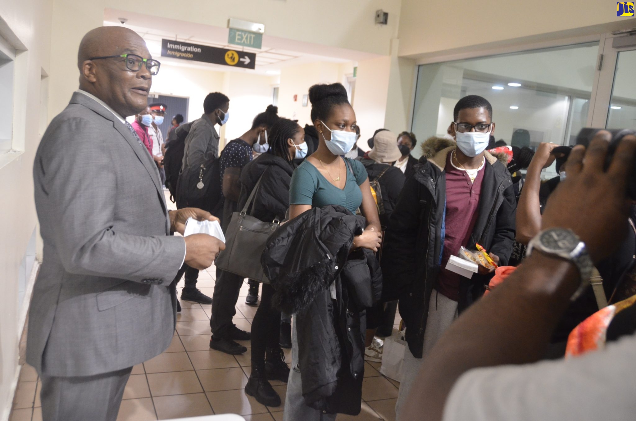 Minister of State in the Ministry of Foreign Affairs and Foreign Trade, Hon. Leslie Campbell, addressing Jamaican students on their arrival at the Sangster International Airport in Montego Bay from Ukraine on March 2.