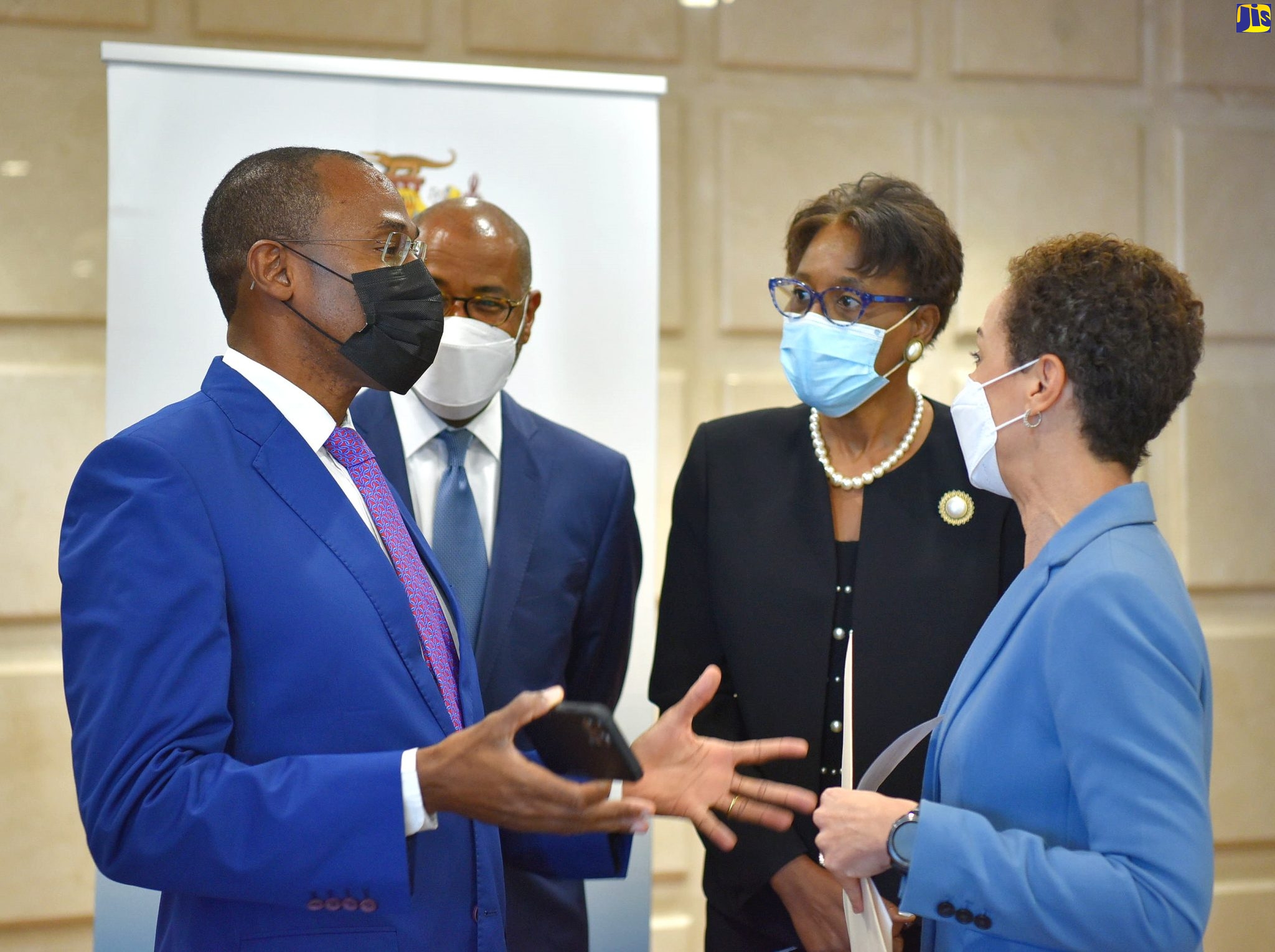 Minister of Finance and the Public Service, Dr. the Hon. Nigel Clarke (left), converses with Minister of Foreign Affairs and Foreign Trade, Senator the Hon. Kamina Johnson Smith (right), during a Ministerial Briefing at the Foreign Affairs Ministry in downtown Kingston. The briefing formed part of activities marking Diplomatic Week, from March 8 to 10, under the theme