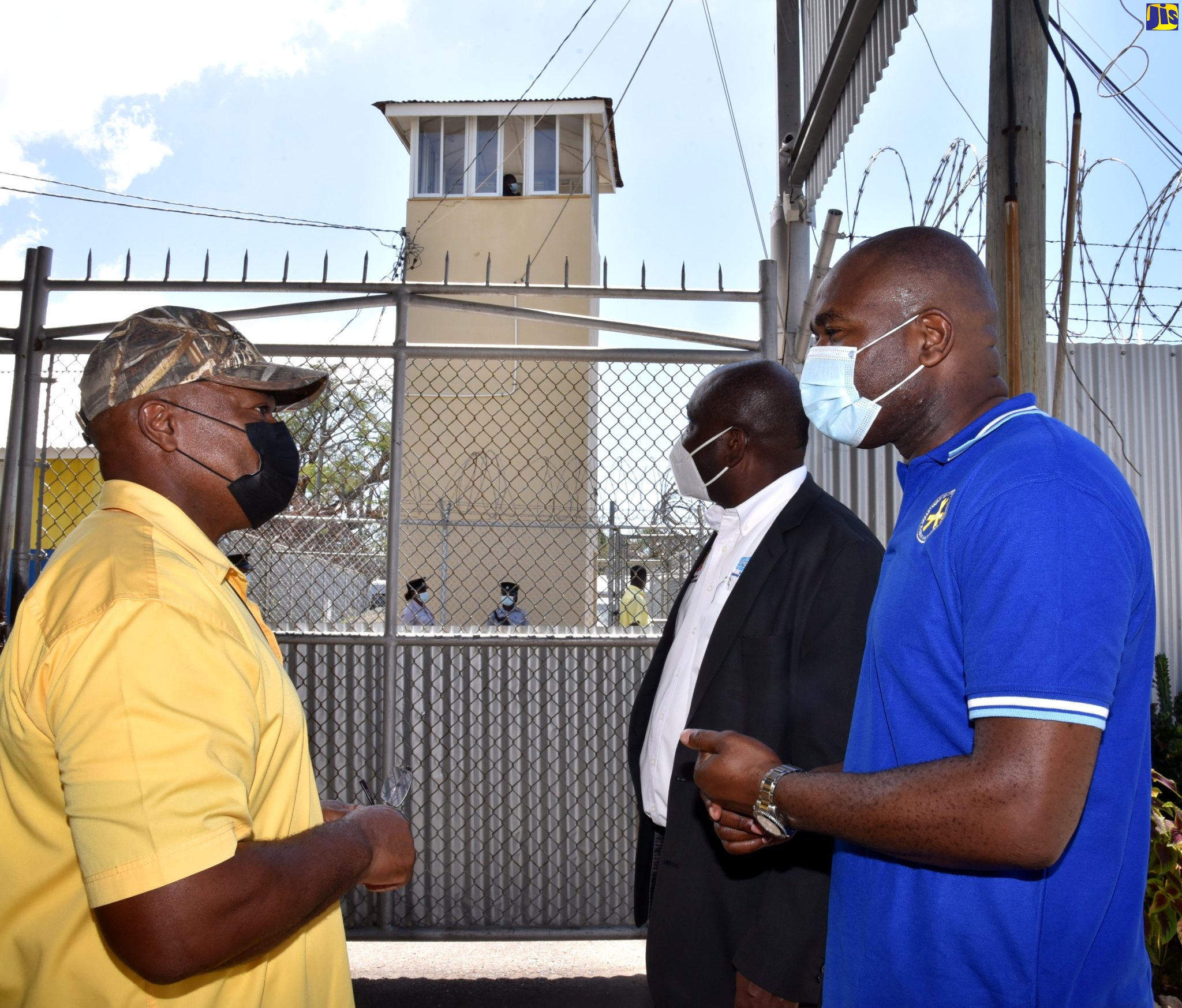 Minister of State in the Ministry of National Security, Hon. Zavia Mayne (right), listens to  Commissioner of Corrections, Lieutenant Colonel (Retired) Gary Rowe, during a tour of the South Camp Juvenile Remand and Correctional Centre, today (March 11). At centre is Permanent Secretary in the Ministry, Courtney Williams.