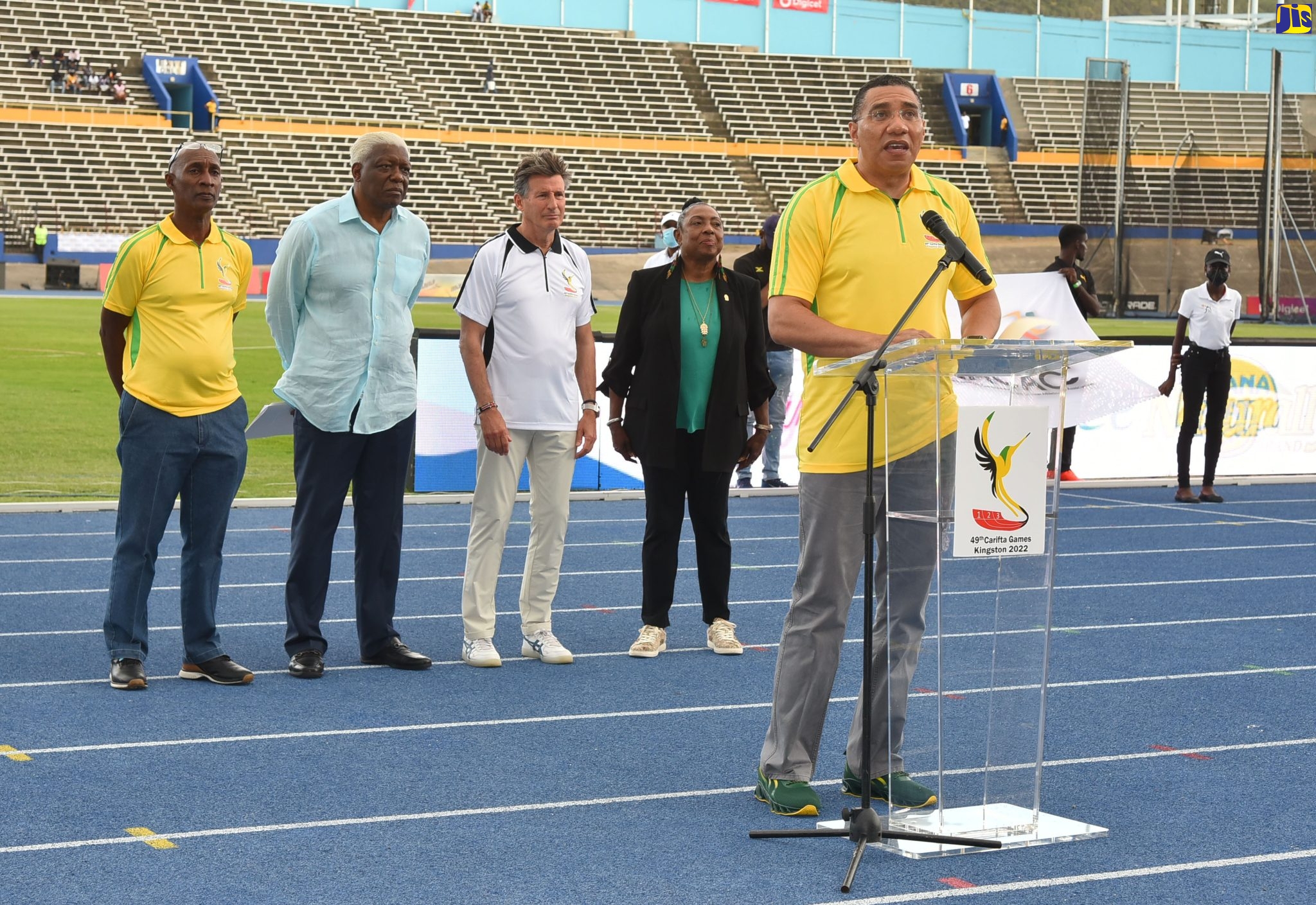 Prime Minister, the Most Hon. Andrew Holness, (at podium), officially opens the 49th staging of the CARIFTA games, at the National Stadium, in Kingston on April 16. Listening on in the background (from left) are President of the Jamaica Athletics Administrative Association (JAAA), Garth Gayle, President of the North American, Central American and Caribbean Athletics Association, Mike Sands, President of World Athletics, Lord Sebastian Coe, and Minister of Culture, Gender, Entertainment and Sport, Hon. Olivia Grange.