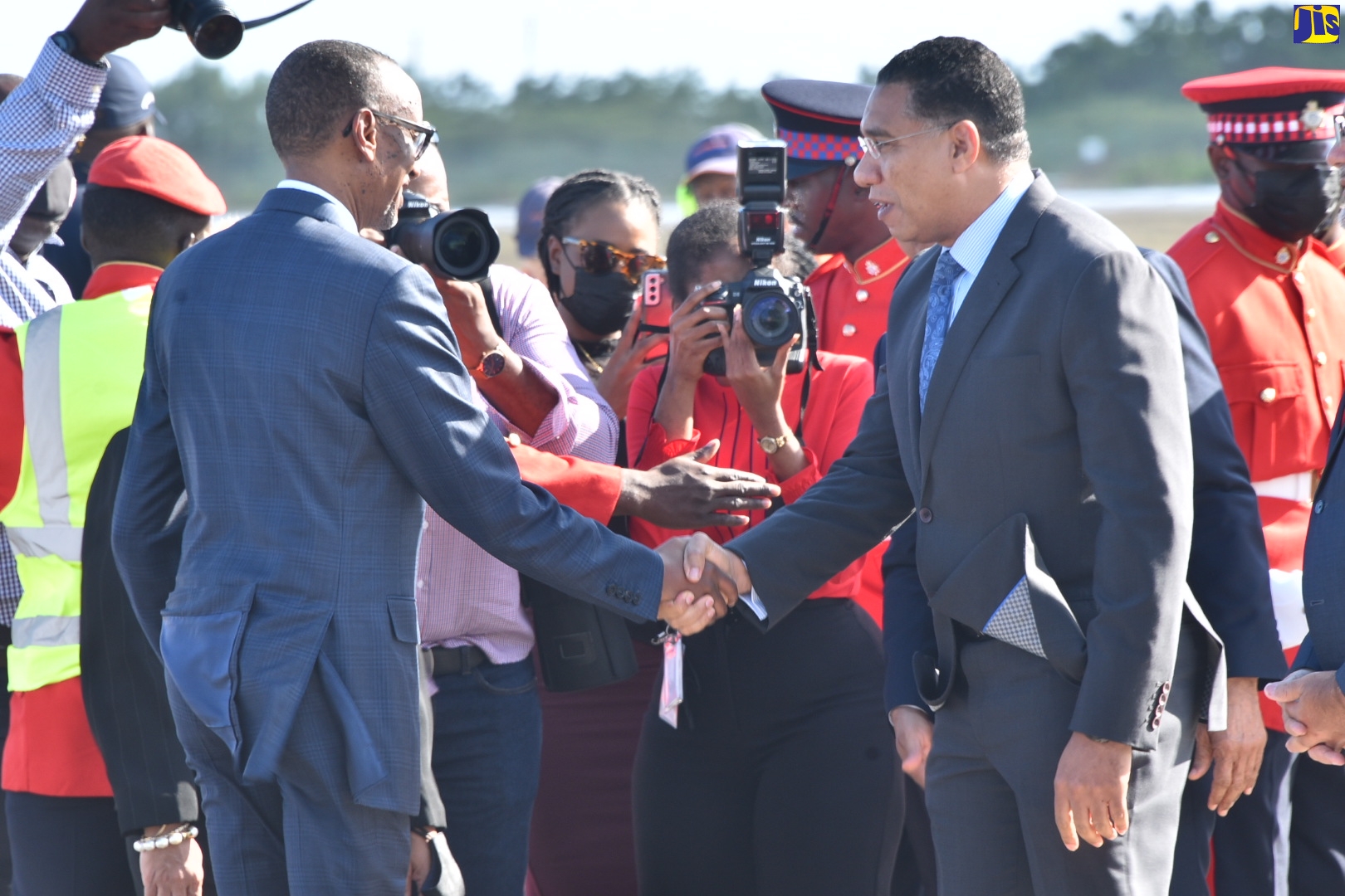 President of the Republic of Rwanda, His Excellency Paul Kagame (left), greets Prime Minister of Jamaica, the Most Hon. Andrew Holness, upon his arrival in the country at the Norman Manley International Airport in Kingston today (April 13).  Photo: Donald De La Haye

