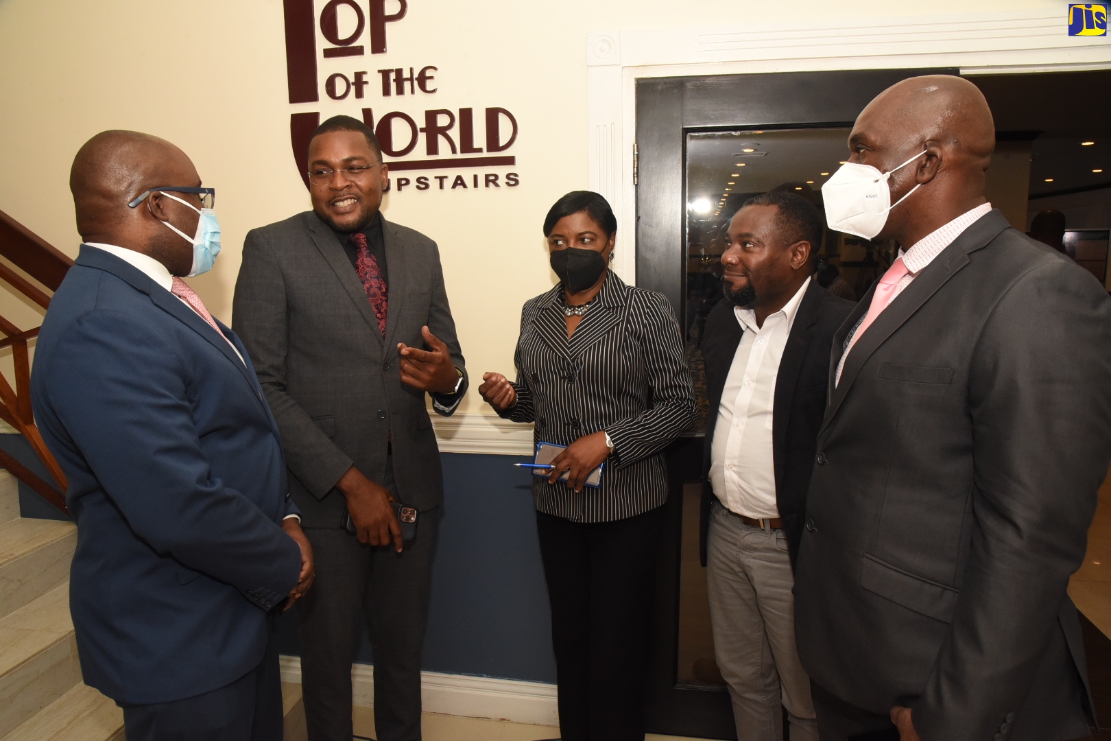 Minister without Portfolio in the Office of the Prime Minister (OPM) with responsibility for Information, Hon. Robert Morgan (second left), makes a point to Acting Principal Director, Information Division, OPM, Damian Cox (left), during the official launch of Records Information Management (RIM) Month of activities, at The Jamaica Pegasus hotel in New Kingston on April 6. Sharing in the conversation (from second left) are Archives Advisory Committee Member, Andrea C. Whyte; Certified Archivist in Information Management, Emerson Bryan; and Principal Director, Public Sector Modernisation Division, Office of the Cabinet, Wayne Thompson.



