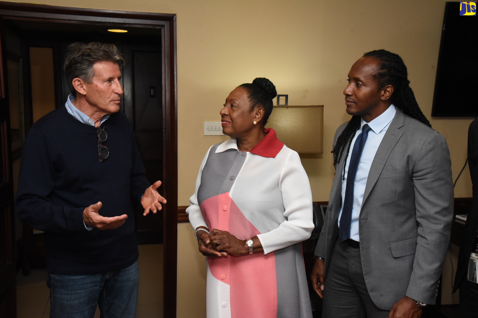 Minister of Culture, Gender, Entertainment and Sport, Hon. Olivia Grange (centre), shares in conversation with International Association of Athletics Federations (IAAF) President, Lord Sebastian Coe (left) after his arrival at the Norman Manley International Airport in Kingston on April 15. Looking on is State Minister in the Ministry of Culture, Gender, Entertainment and Sport, Hon. Alando Terrelonge.