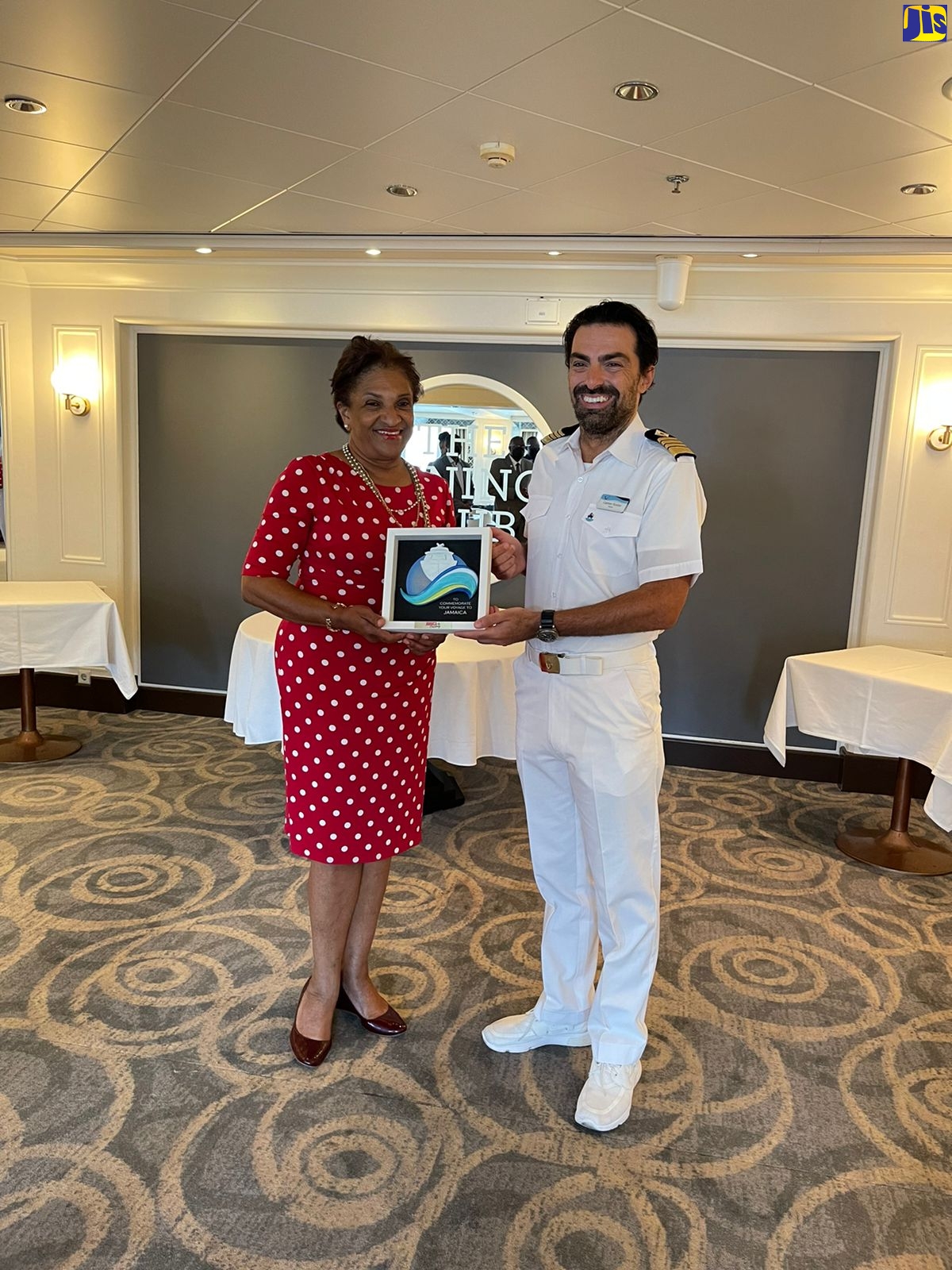 Marella Explorer 2’s Captain, Kostas Lampropoulous, receives a gift from Executive Director of Jamaica Vacations (JAMVAC), Joy Roberts, on board the cruise vessel at the Montego Bay Cruise Port, St. James, on April 12.