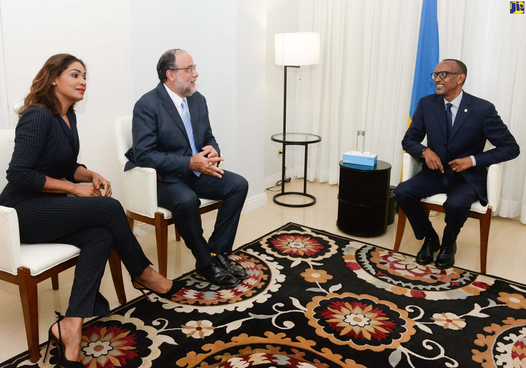 President of the Republic of Rwanda, His Excellency Paul Kagame (right),  engages Leader of the Opposition, Mark Golding (centre), and Opposition Spokesperson on Foreign Affairs and Foreign Trade, Lisa Hanna (left), during a courtesy call on the Opposition Leader, at The Jamaica Pegasus hotel in New Kingston, St. Andrew, today (April 14). President Kagame is on the island for a three-day State visit from April 13 to 15.