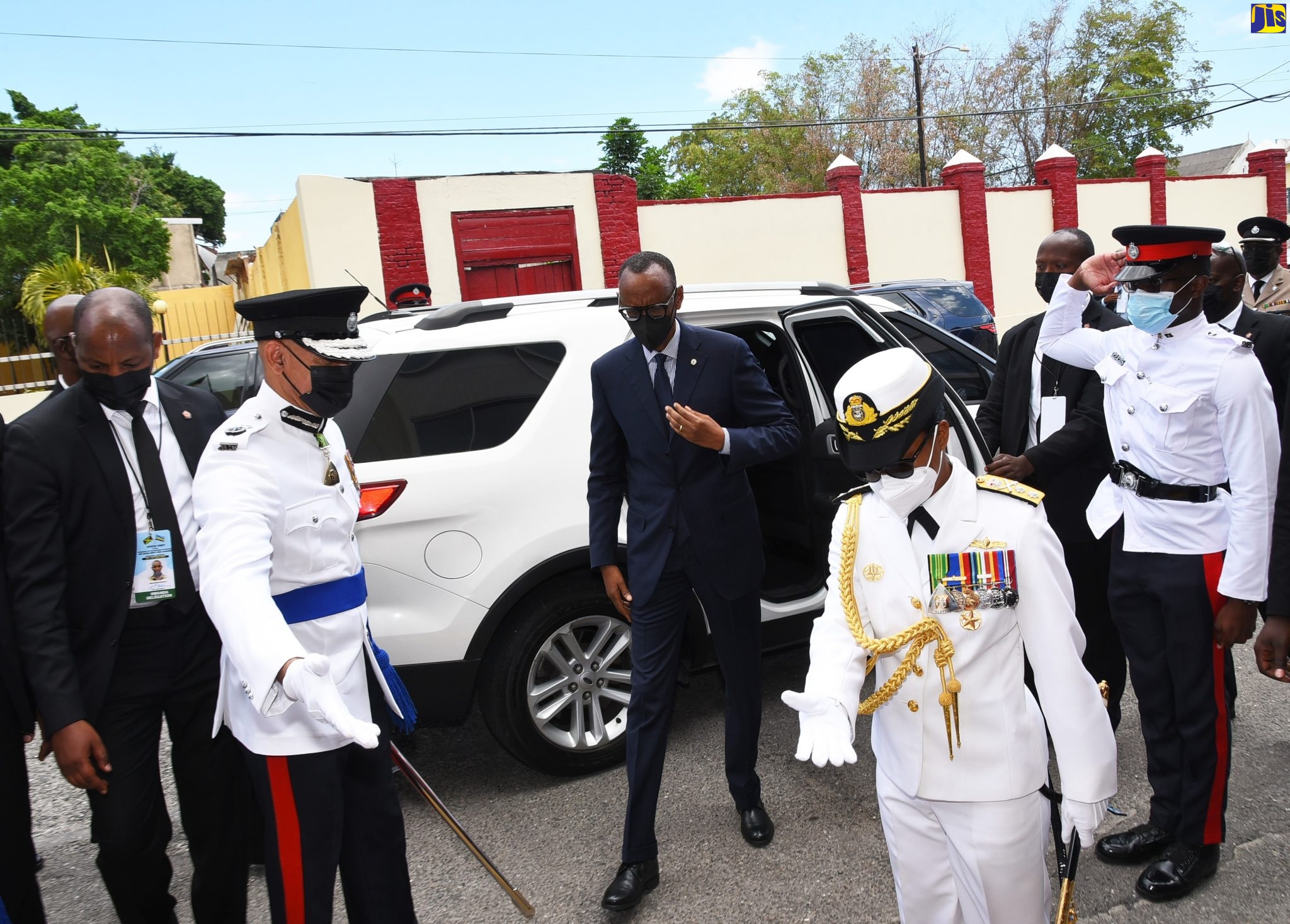 President of the Republic of Rwanda, His Excellency Paul Kagame (centre), arrives at Gordon House on Thursday (April 14) to address the joint sitting of the Houses of Parliament. He is escorted into the building by Commissioner of Police, Major General Antony Anderson (second left); and Chief of Defence Staff (CDS), Rear Admiral Antonette Wemyss-Gorman (second right). The event is part of the schedule of activities for his three-day State visit to Jamaica. The President leaves the island on Friday (April 15).