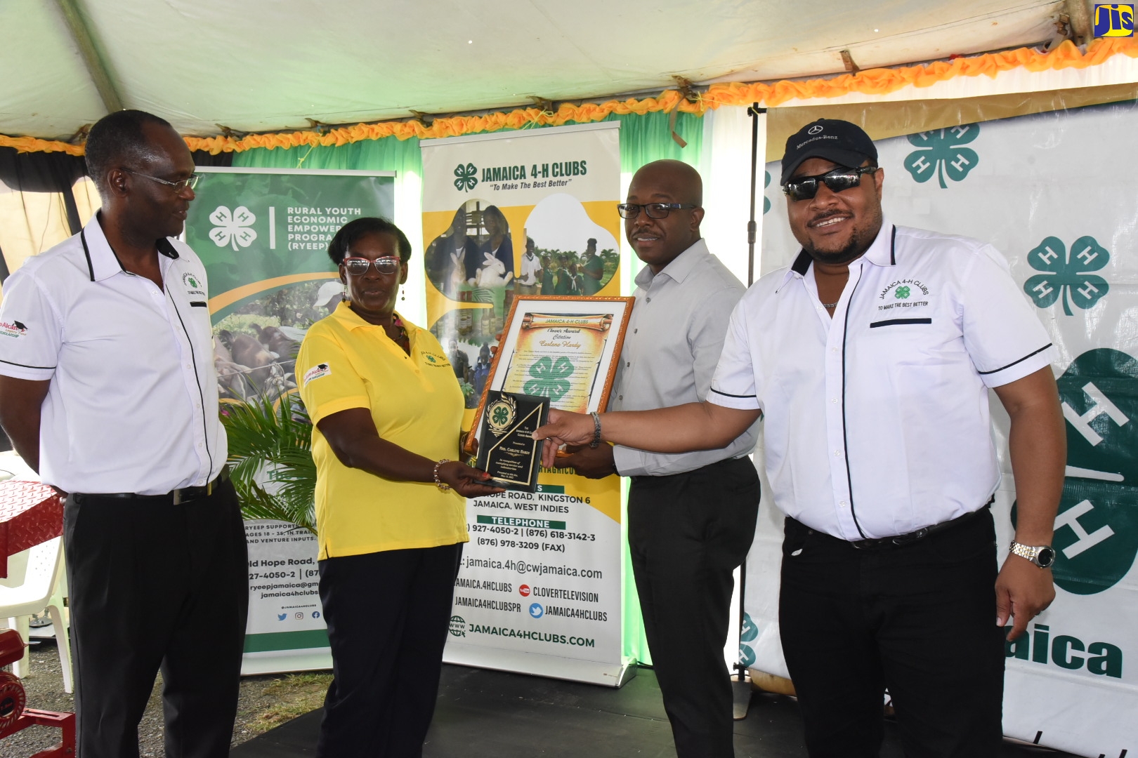 Minister of Agriculture and Fisheries, Hon. Pearnel Charles Jr. (second right), presents Jamaica 4-H Clubs’ Portland Parish Manager, Norma Myers (second left), with the Clover Award for Portland Club volunteer, Carlene Hardy. Occasion was the Clubs’ National Achievement Exposition, held at the Denbigh Showground in Clarendon on Friday (May 13). Others sharing the moment (from left) are Executive Director of the 4-HClubs, Dr. Ronald Blake and Chairman of the organisation, Colin Virgo.

 

