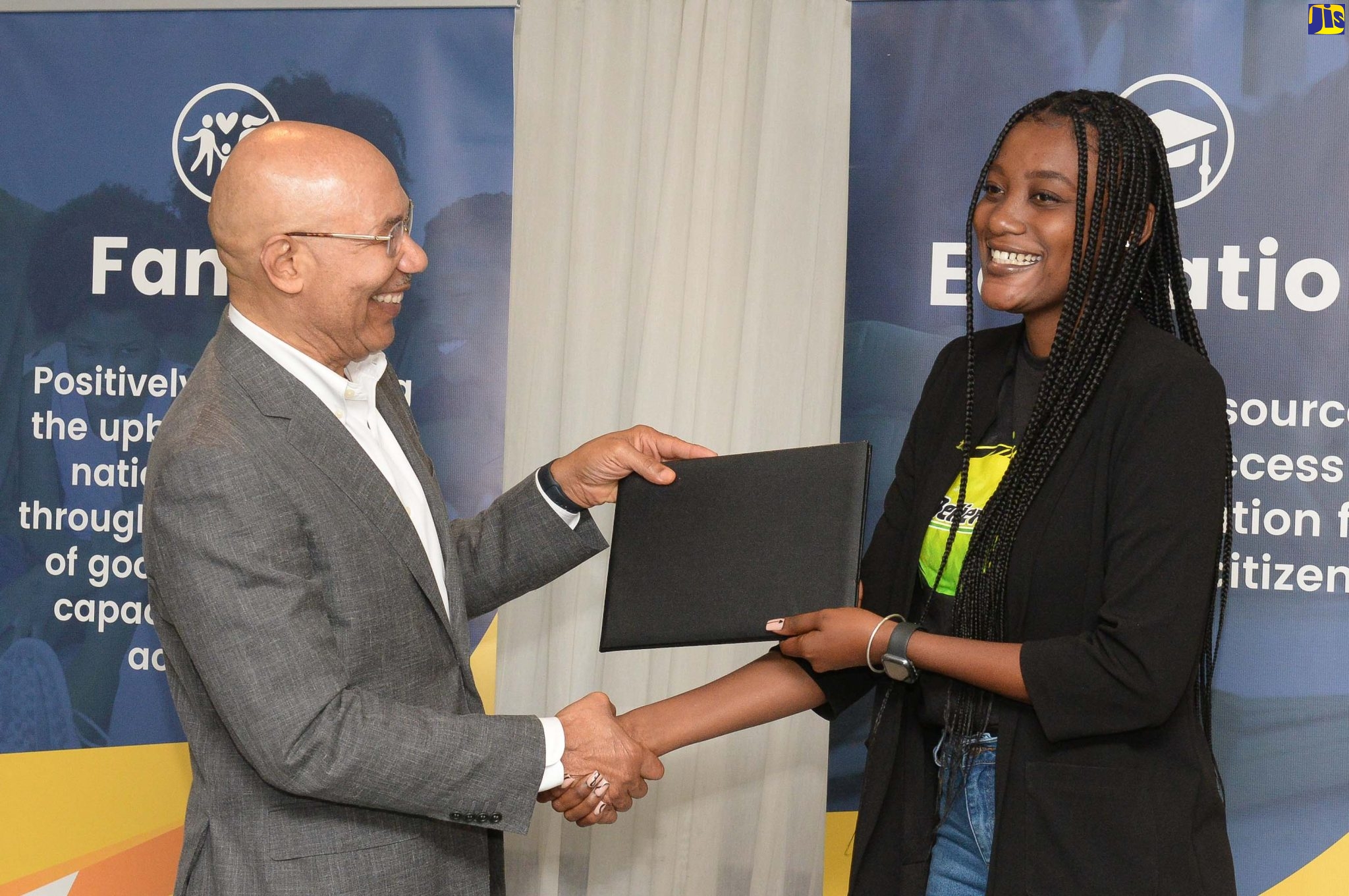 Governor-General, His Excellency, the Most Hon. Sir Patrick Allen (left), presents ‘I Believe Initiative’ (IBI) Ambassador, Chevelle Campbell, with a certificate of appreciation during the Governor-General’s Programme for Excellence Annual General Meeting held on May 1 at The Jamaica Pegasus hotel in Kingston.  The GGPE was established in 2014 to give cohesiveness to programmes that are affiliated to the Office of the Governor-General – the Governor-General’s Achievement Awards (GGAA) and the I Believe initiative (IBI).