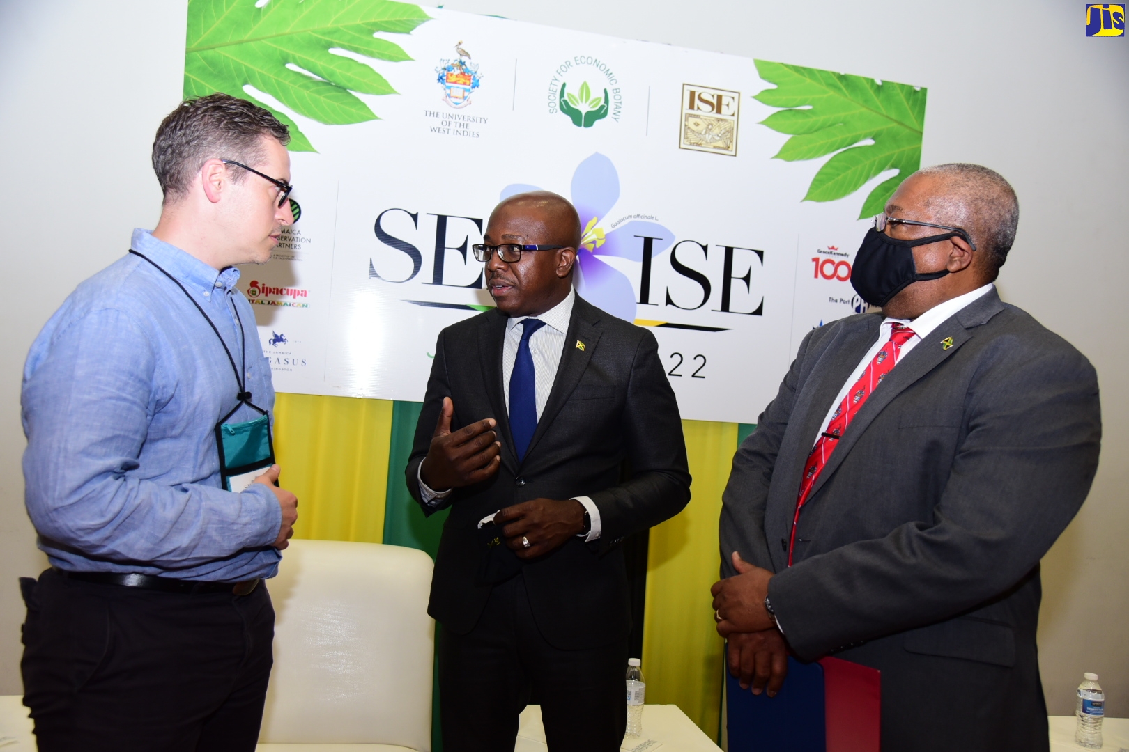 Minister of Agriculture and Fisheries, Hon. Pearnel Charles Jr. (centre), speaks with President, Society for Economic Botany (SEB), John de la Parra, during the opening ceremony for the 2022 International Joint Conference of SEB and the International Society of Ethnobiology (ISE), (SEB-ISE Jamaica 2022) on Sunday (May 30) at the host institution, the University of the West Indies (UWI), Mona Campus, St. Andrew. At right is Pro-Vice Chancellor and Principal, UWI Mona Campus, Professor Dale Webber.