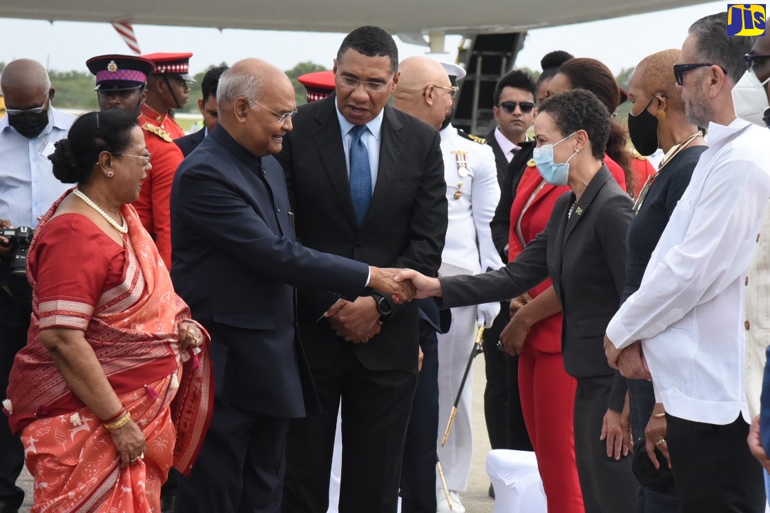 President of the Republic of India, His Excellency the Hon. Ram Nath Kovind (second left, foreground), is greeted by Minister of Foreign Affairs and Foreign Trade, Senator the Hon. Kamina Johnson Smith (fourth right) when he arrived at the Norman Manley International airport in Kingston on Sunday (May 15) for a four-day State Visit to Jamaica. Prime Minister, the Most Hon. Andrew Holness (third left foreground), led the introductions. Pictured at left (foreground) is First Lady, Savita Kovind and at third right is Minister of Education and Youth, Hon. Fayval Williams.