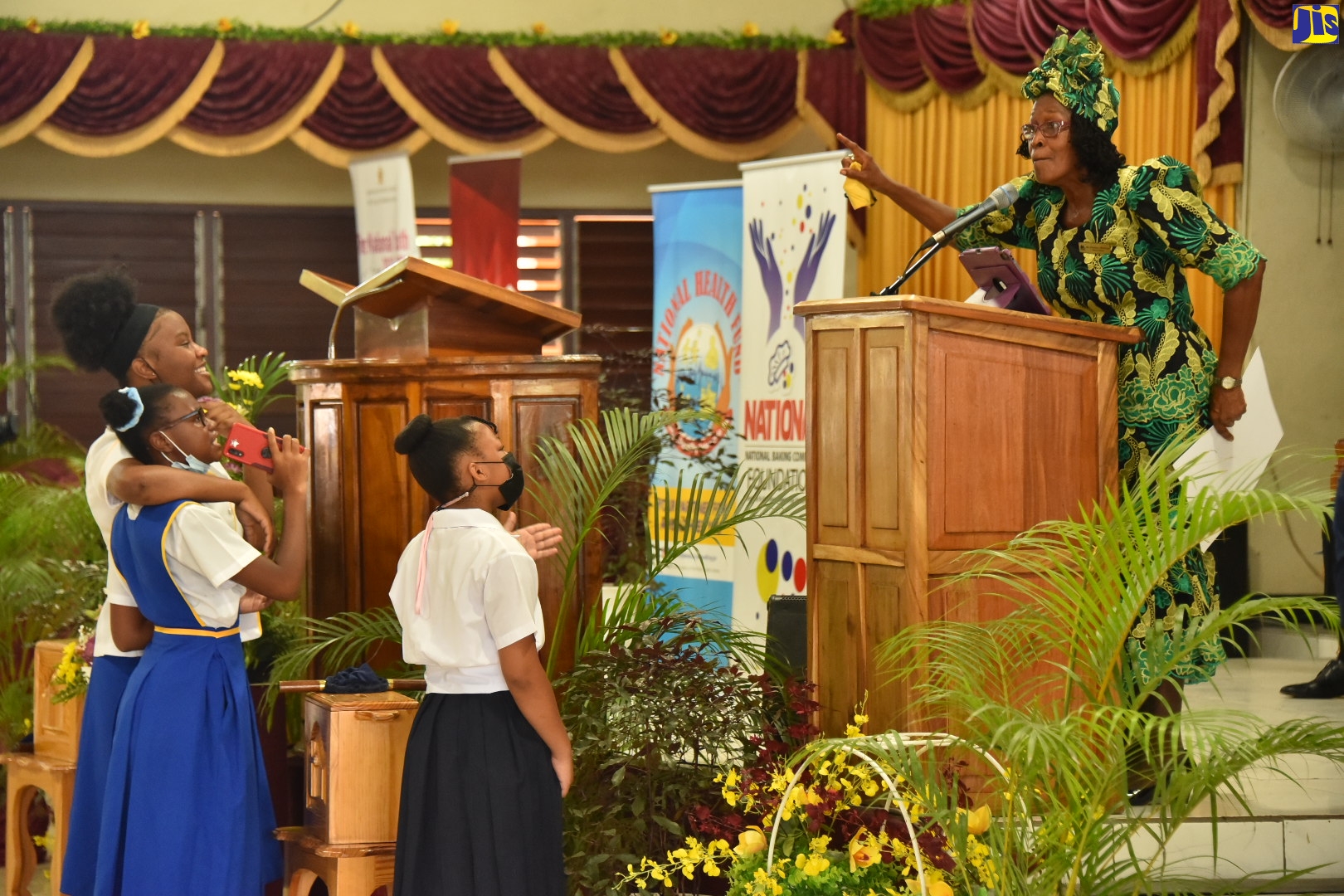 Chairperson of the National Child Month Committee, Dr. Pauline Mullings (at lectern), engages students participating in the Child Month Church Service held at the Eastwood Park New Testament Church of God in St. Andrew on Sunday (May 1). Hosted by the Ministry of Education and Youth and the National Child Month Committee, the service was held under the theme ‘Listen Up! Children’s Voices Matter’.