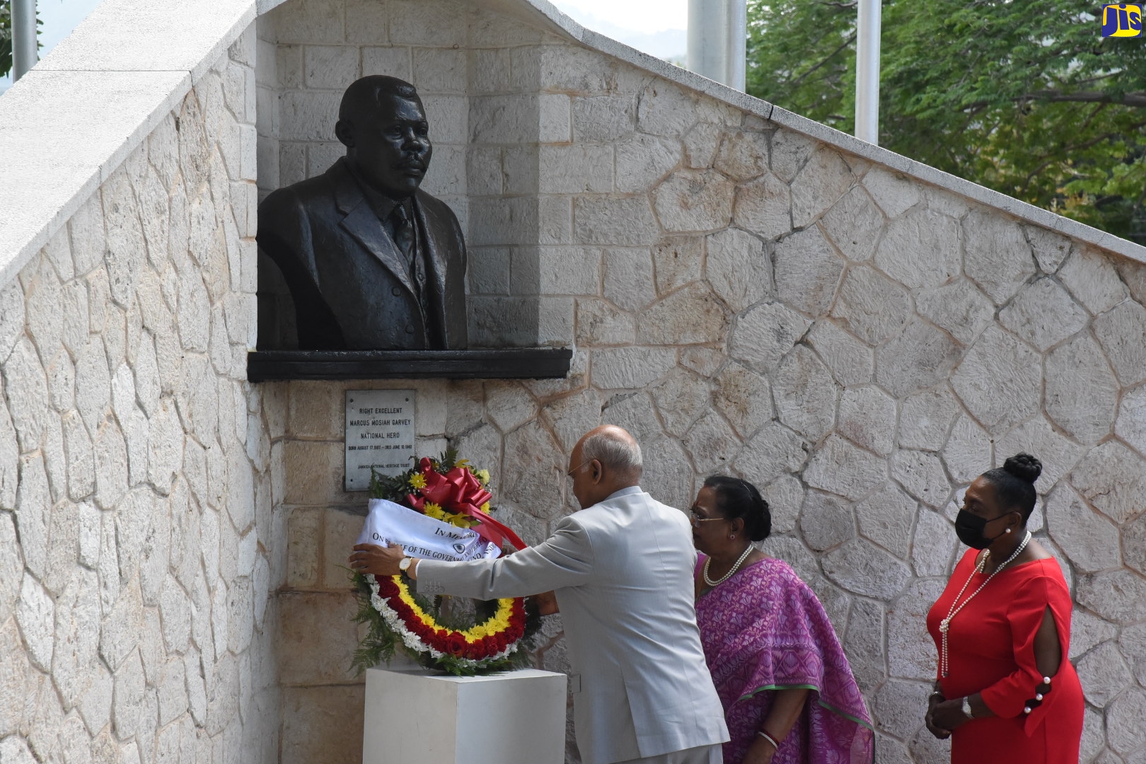President of the Republic of India, His Excellency the Hon. Ram Nath Kovind, lays a floral tribute at the shrine of National Hero, the Rt. Excellent Marcus Garvey, at National Heroes Park, Kingston, on Monday ((May 16). Assisting him is First Lady of India, Savita Kovind (centre). Looking on is Minister of Culture, Gender, Entertainment and Sport, Hon. Olivia Grange.  President Kovind arrived in the island on Sunday (May 15) for a four-day State Visit.
