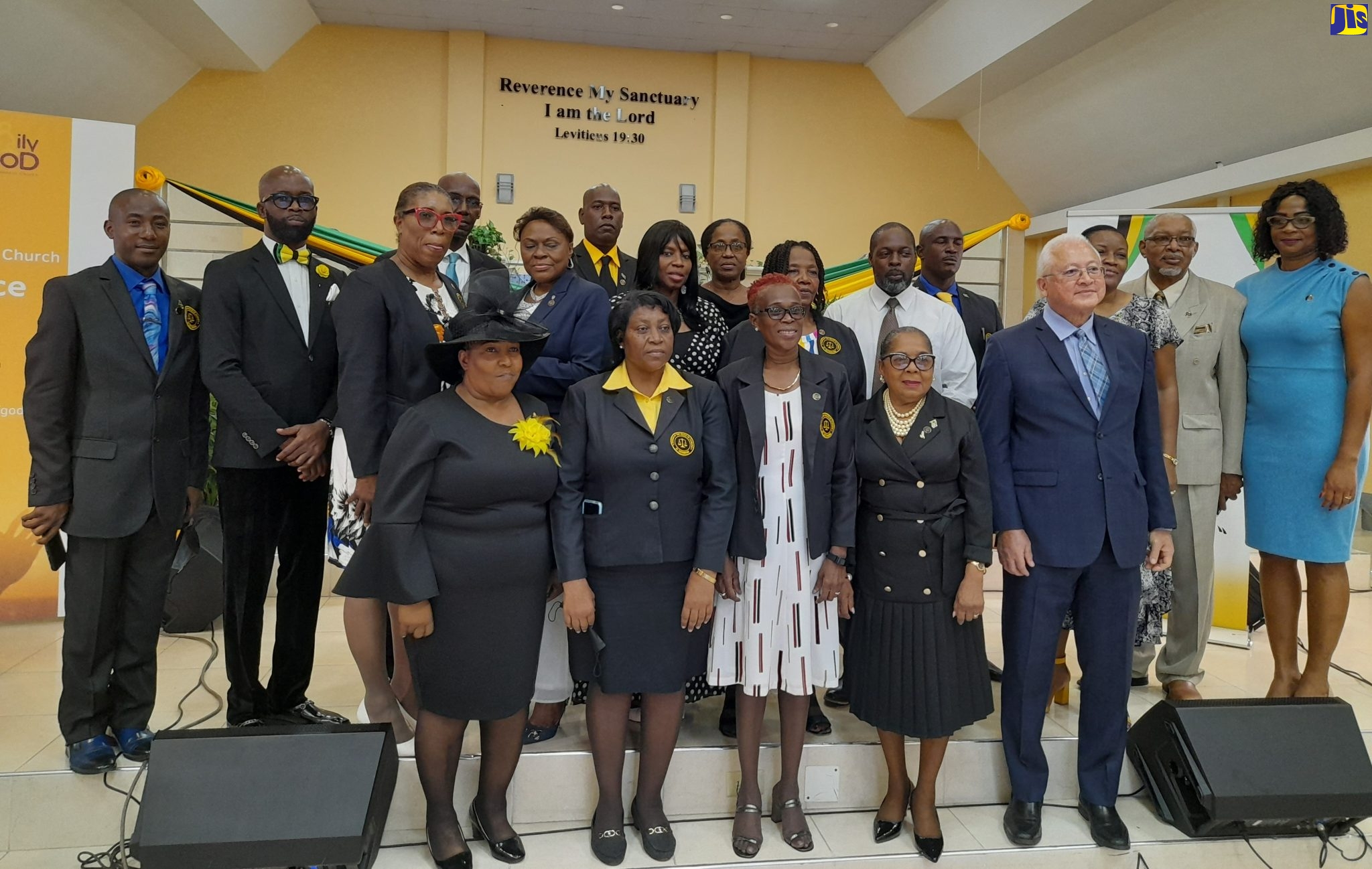 Minister of Justice, Hon. Delroy Chuck (right, front row), and Custos of St. Catherine, Hon. Icylin Golding (second right, front row), with executive members of the St. Catherine Justices of the Peace (JP) Association, during the recent launch of the group,  held at the Family of God Seventh-day Adventist Church in Spanish Town, in the parish.