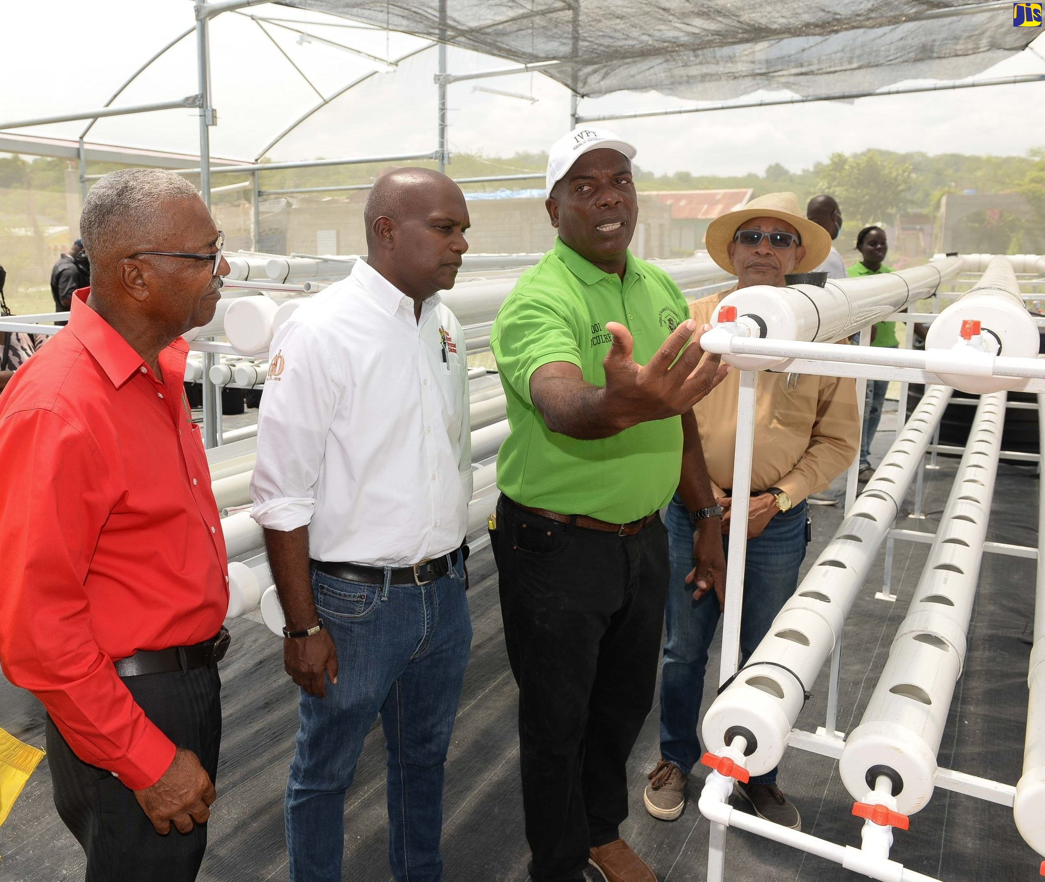 Executive Chairman, Institute of Vocational and Professional Training (IVPT), Randy Finnikin (third left), shows a section of the Institute’s greenhouse to (from left), Jamaica Agricultural Society Vice President, Denton Alvaranga and General Operations Manager, Best Dressed Chicken Processing Plant, Steve Palmer. Looking on (at right, foreground) is Chairman of the Spring Village Development Foundation, Wayne Saunderson.
