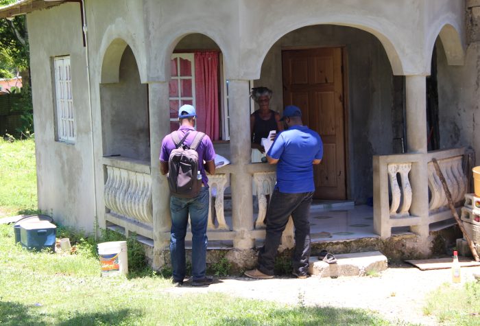 Officers and residents in Field in Rice Piece B