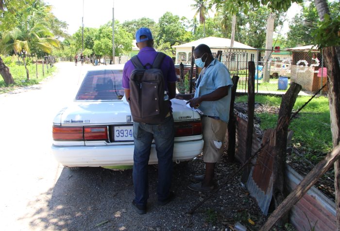 Officers and residents in Field in Rice Piece c