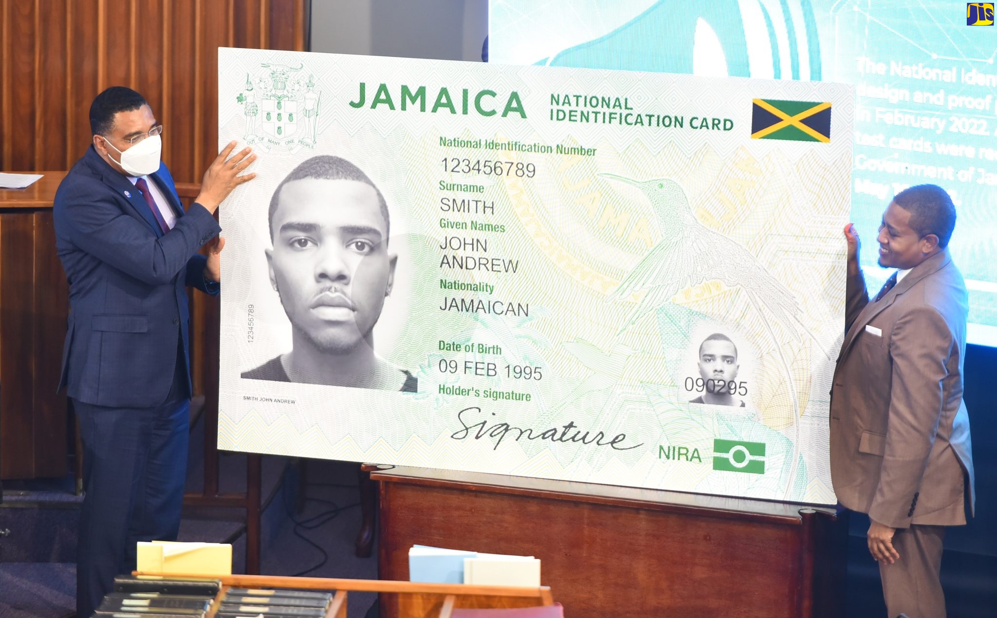 Prime Minister, the Most Hon. Andrew Holness (left), and Minister without Portfolio in the Office of the Prime Minister, Hon. Floyd Green unveil the design on the front of the country’s first National Identification (ID) card. The card, which is to be provided free of cost to citizens under the soon to be rolled out National Identification System (NIDS) was revealed during Minister Green’s contribution to the 2022/23 Sectoral Debate in the House of Representatives on Tuesday (May 24).
